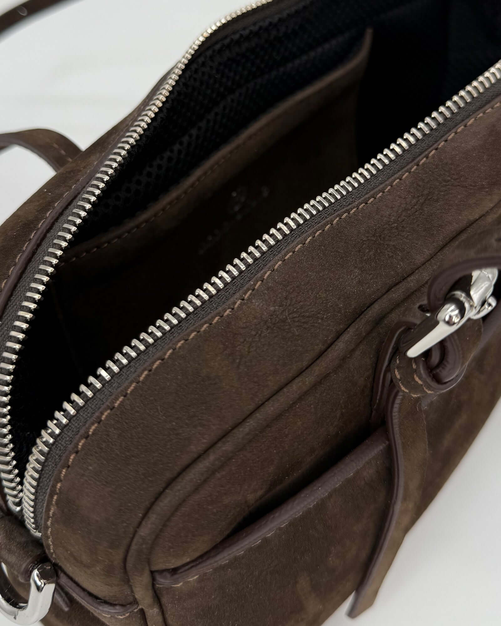 Inside view of the ASIA NABUK bag showcasing its zipper and spacious design.