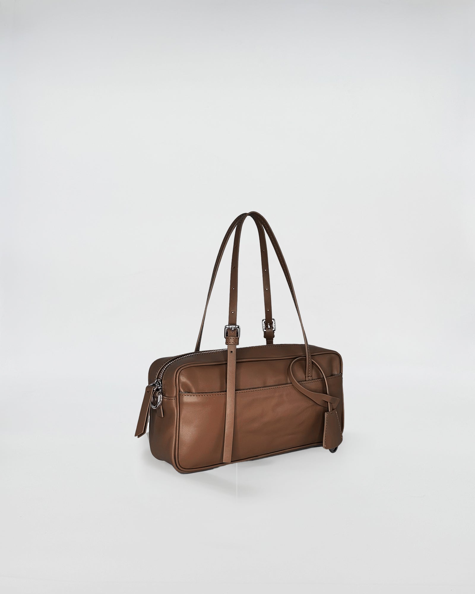 ASIA VITELLO LAVATO brown leather bag with adjustable shoulder strap and minimal design.