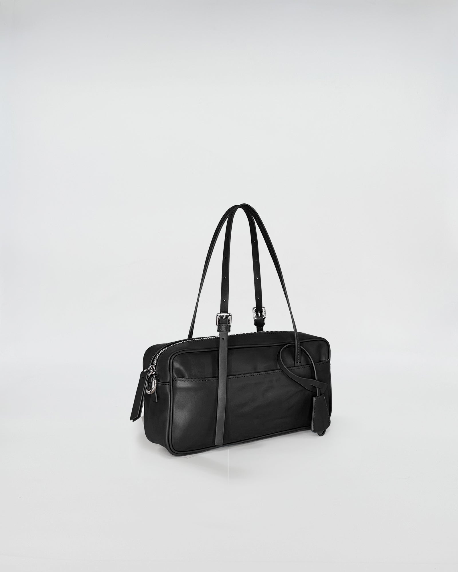 ASIA VITELLO LAVATO black leather bag with adjustable straps and minimalistic design.