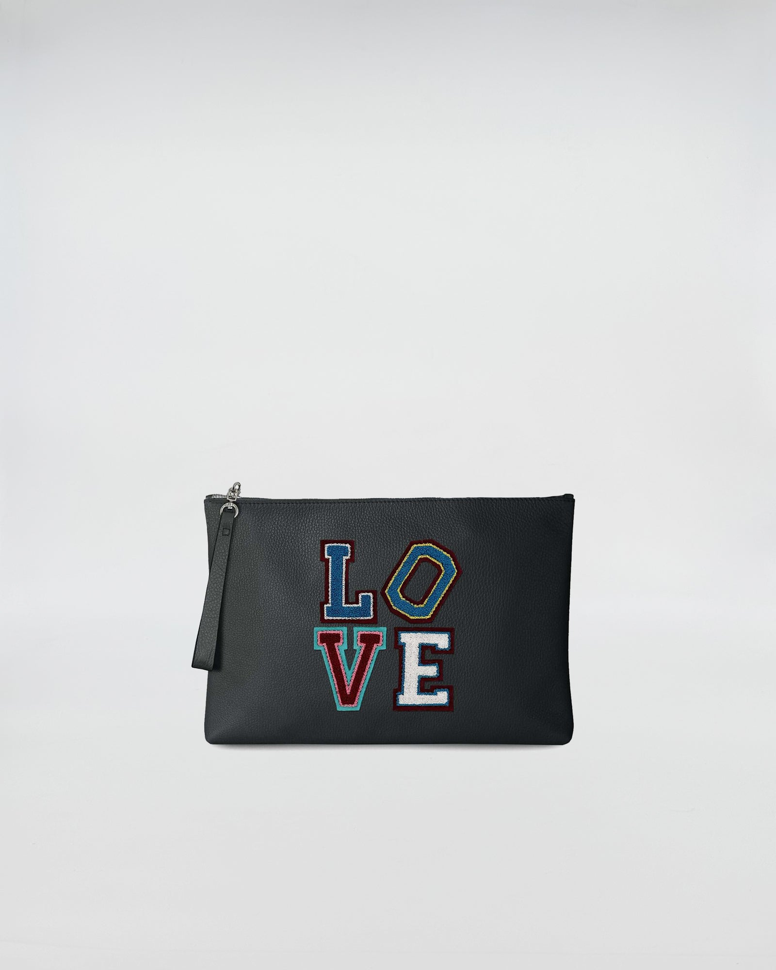 BUSTA A4 LOVE in black leather with colorful LOVE patch, featuring a zip closure and a hand strap.