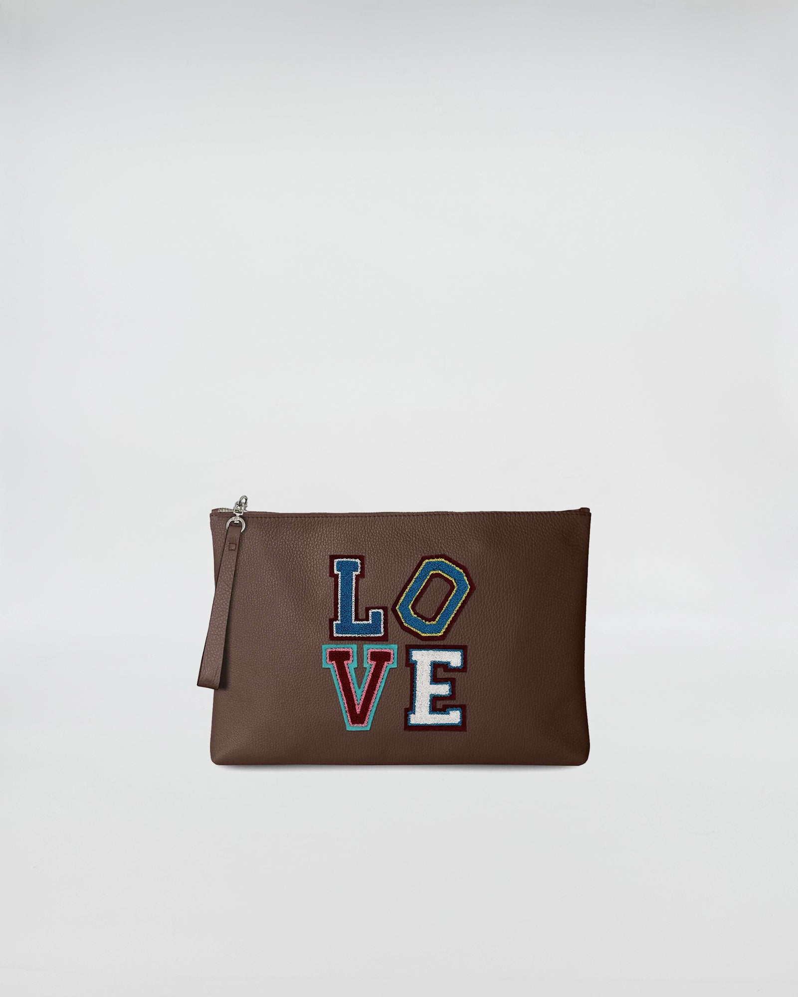 BUSTA A4 LOVE in brown leather with colorful LOVE patch, featuring a zip closure and hand strap.