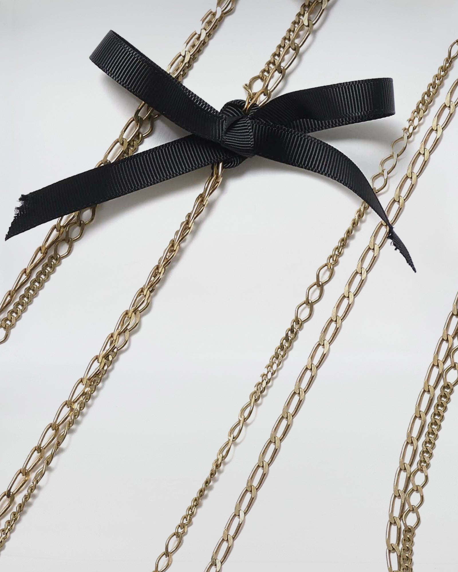 COLLANA MOD. 31 elegant chain necklace with black ribbon detail, showcasing modern design inspired by 1930s aesthetics.