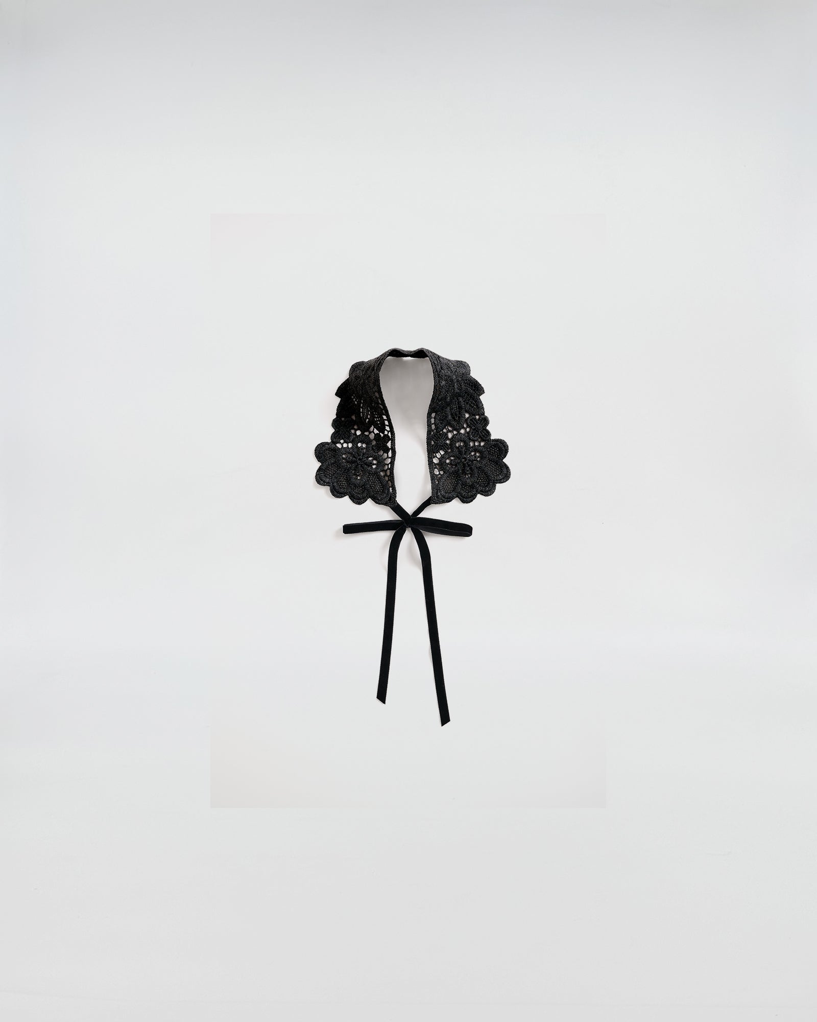 Black macramé lace collar with delicate design, perfect for adding a romantic touch to any outfit.