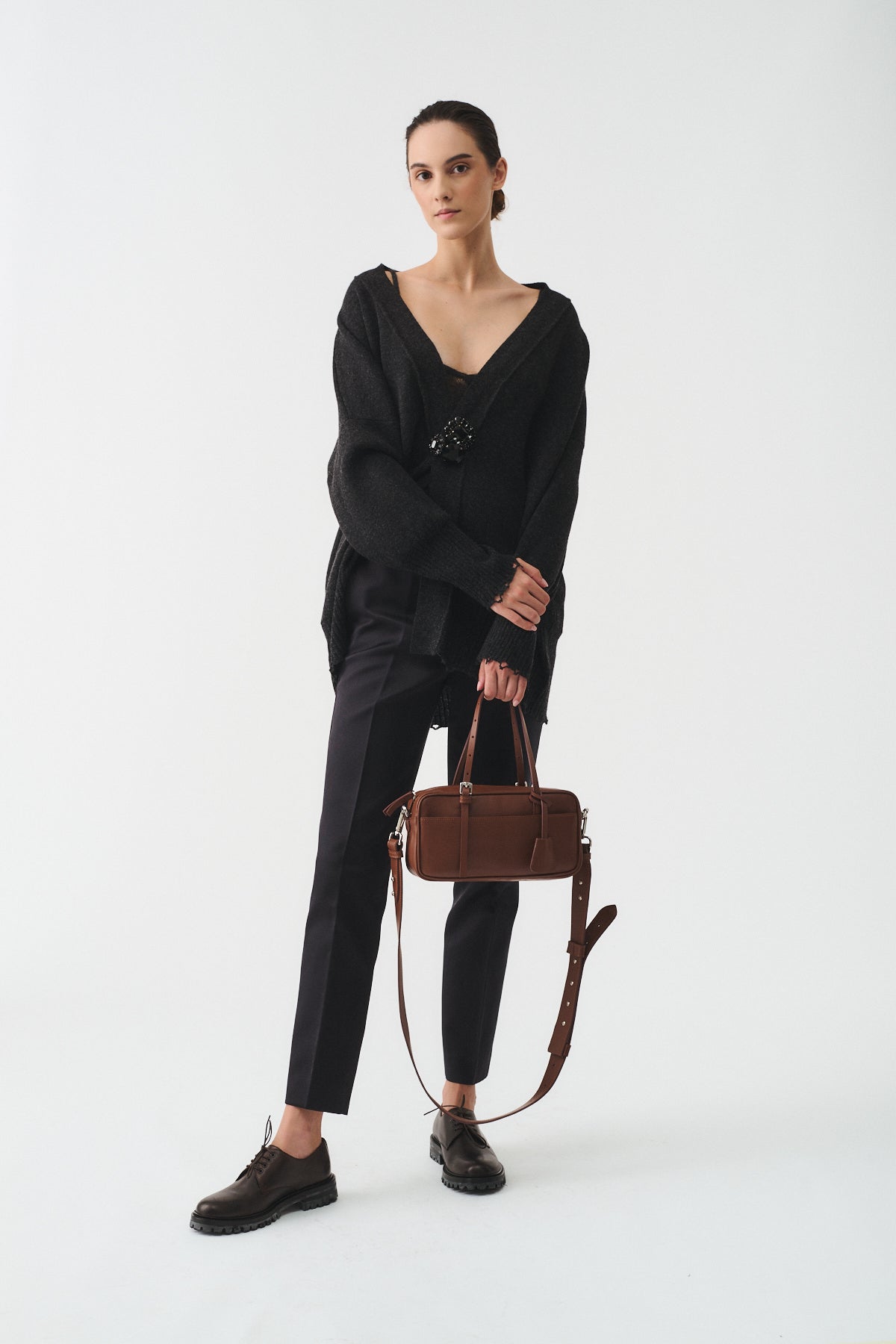 Model showcasing ASIA VITELLO LAVATO bag with a stylish outfit, emphasizing its versatile design and functionality.