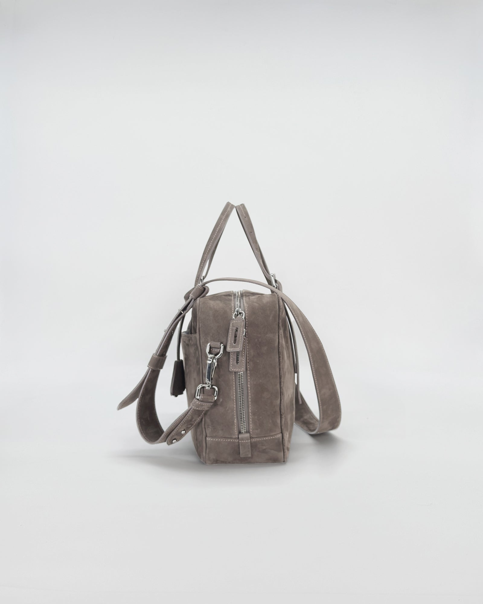 Frida medium nabuk handbag in soft grey with stylish straps and retro design.