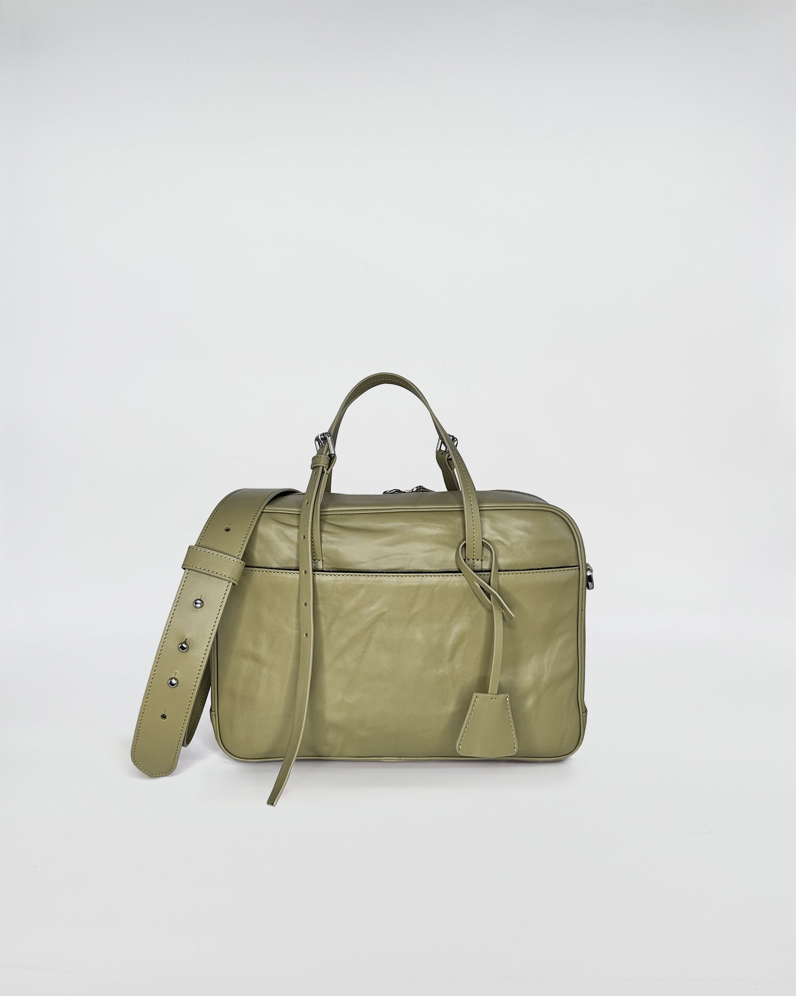 FRIDA MEDIUM VITELLO LAVATO green leather bag with adjustable strap, showcasing modern design with vintage charm.