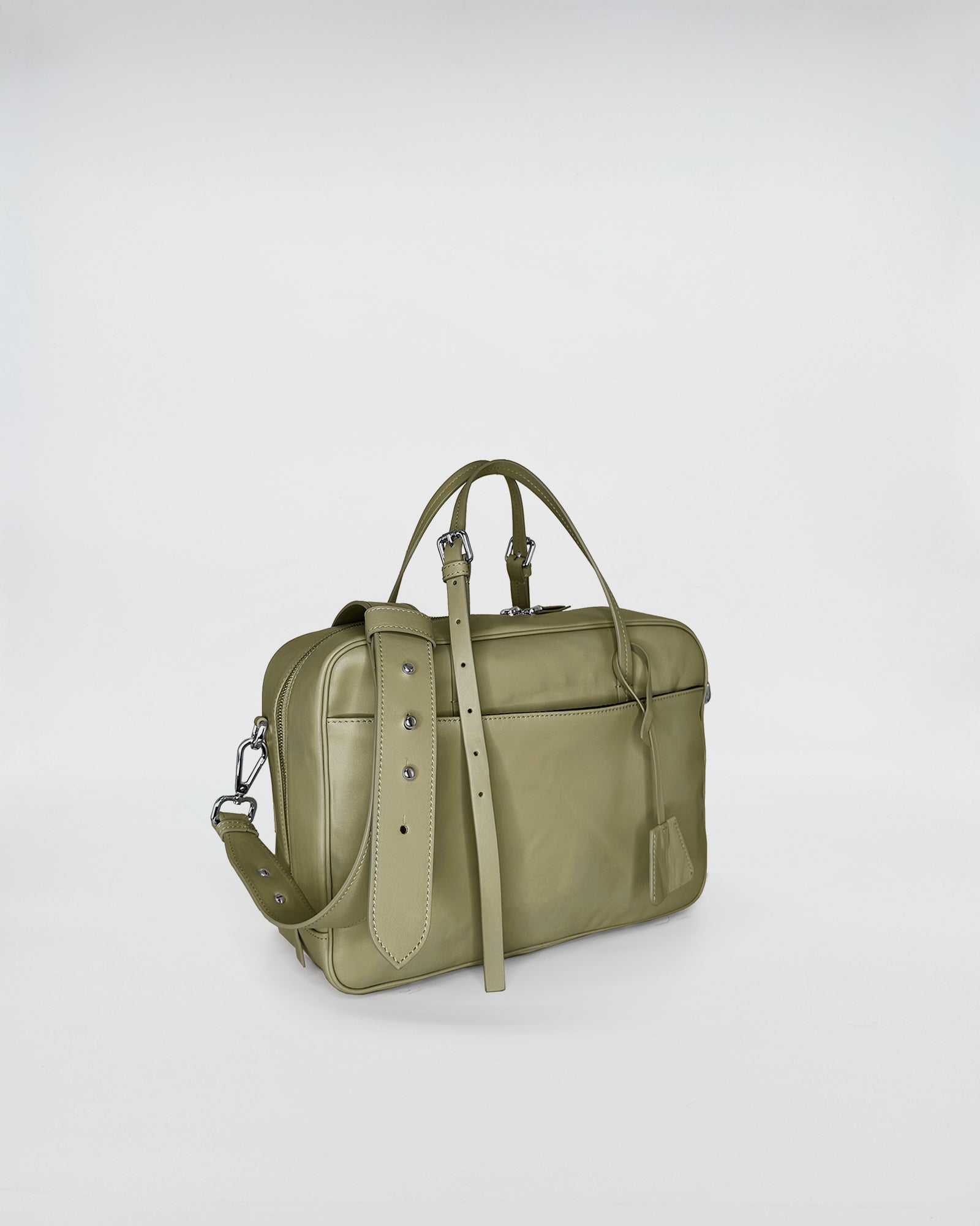 FRIDA MEDIUM VITELLO LAVATO handbag in olive green with adjustable strap, showcasing retro-inspired design and modern versatility.