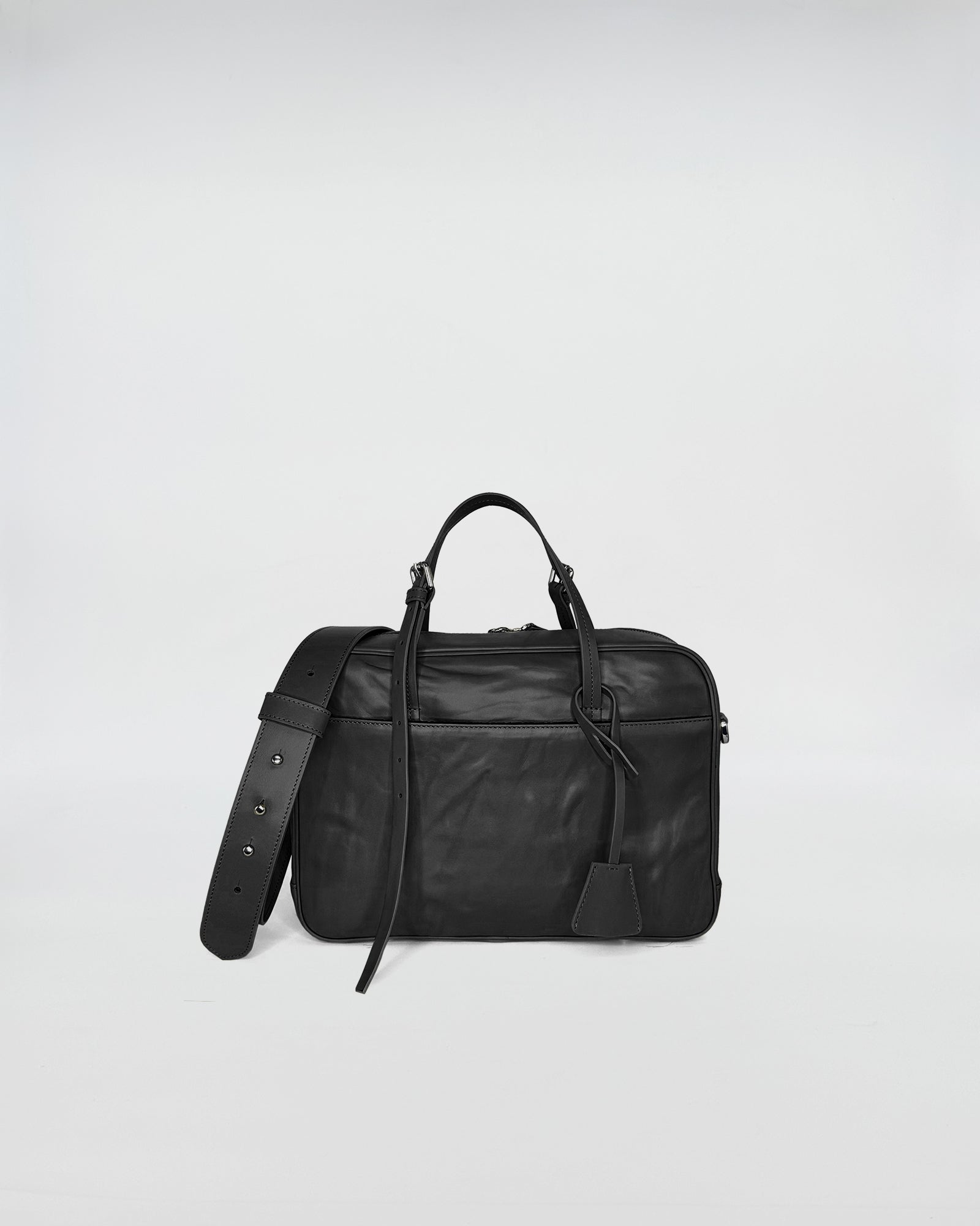 FRIDA SMALL VITELLO LAVATO black bag with adjustable strap and leather handles, elegant and versatile design.