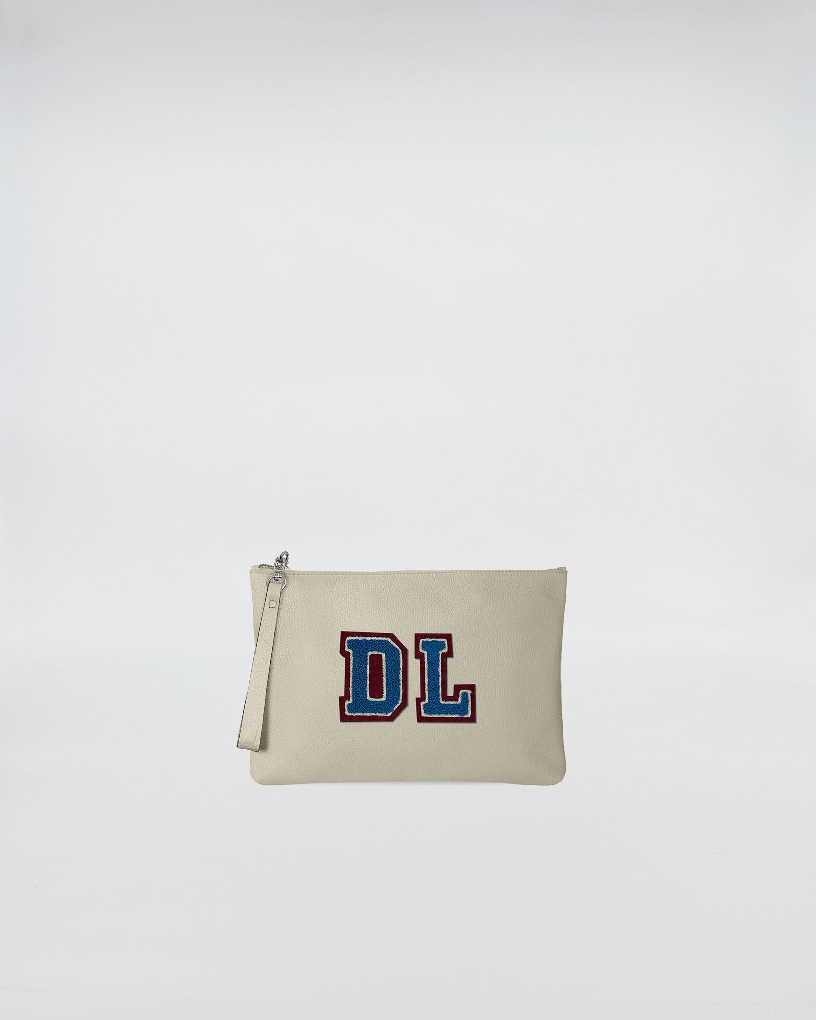 POCHETTE JOY PERSONALIZZATA with personalized patch and zip closure, crafted in soft leather.