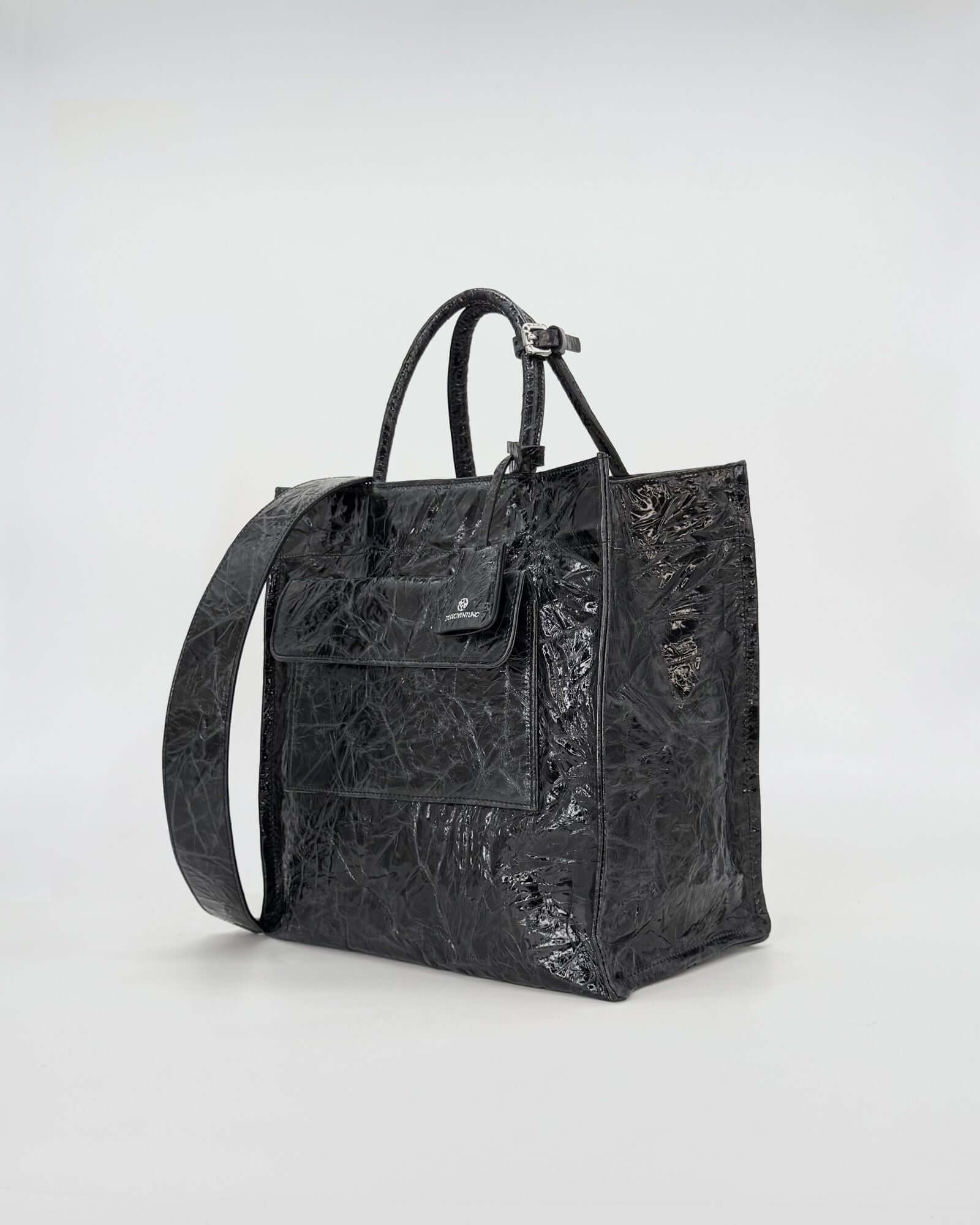 LUDOVICA VITELLO STRIZZATO black shopping bag made of soft grained leather with utility pockets.