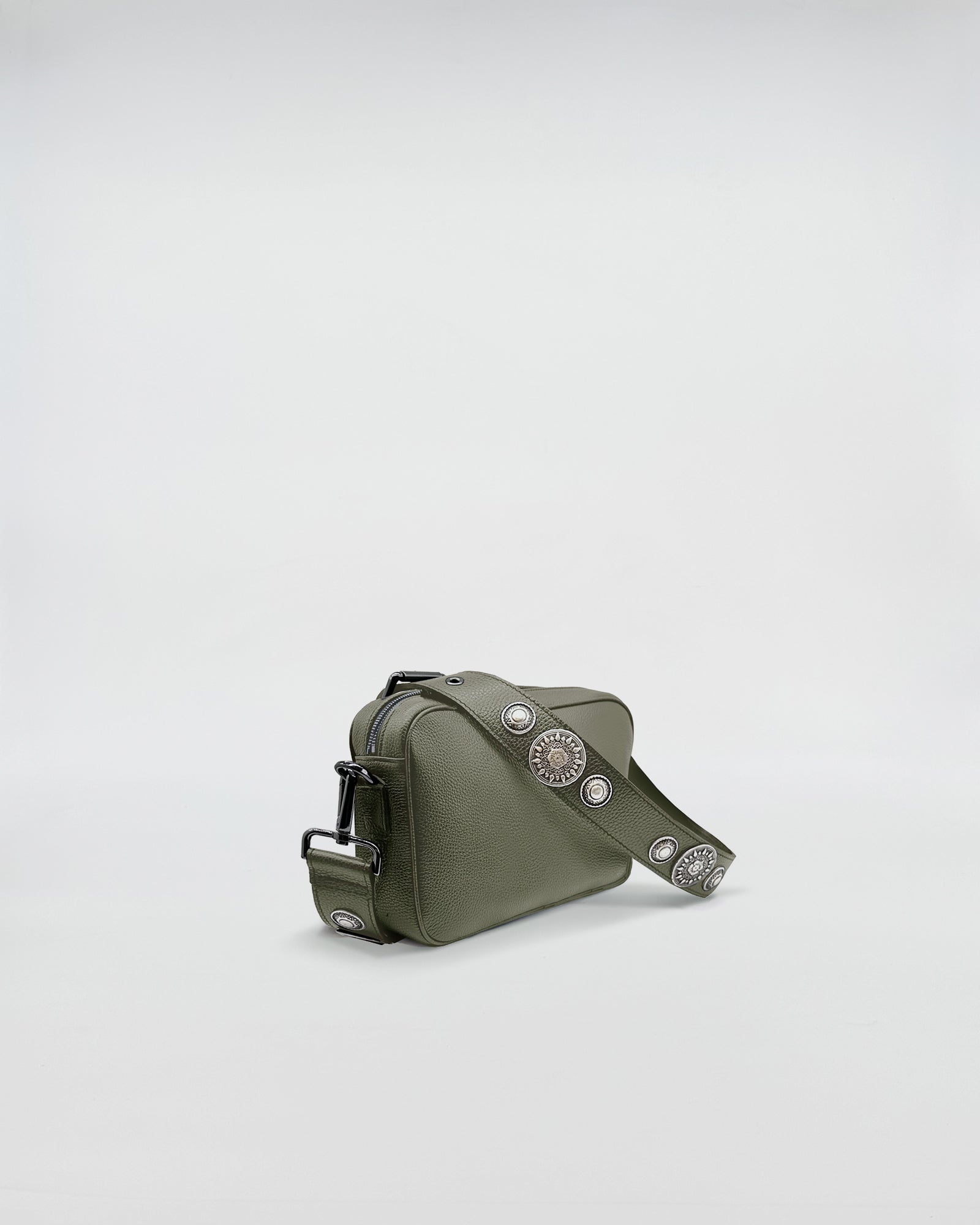 Mafalda Rock bag in olive green with decorative studs and adjustable strap, highlighting its stylish and functional design.
