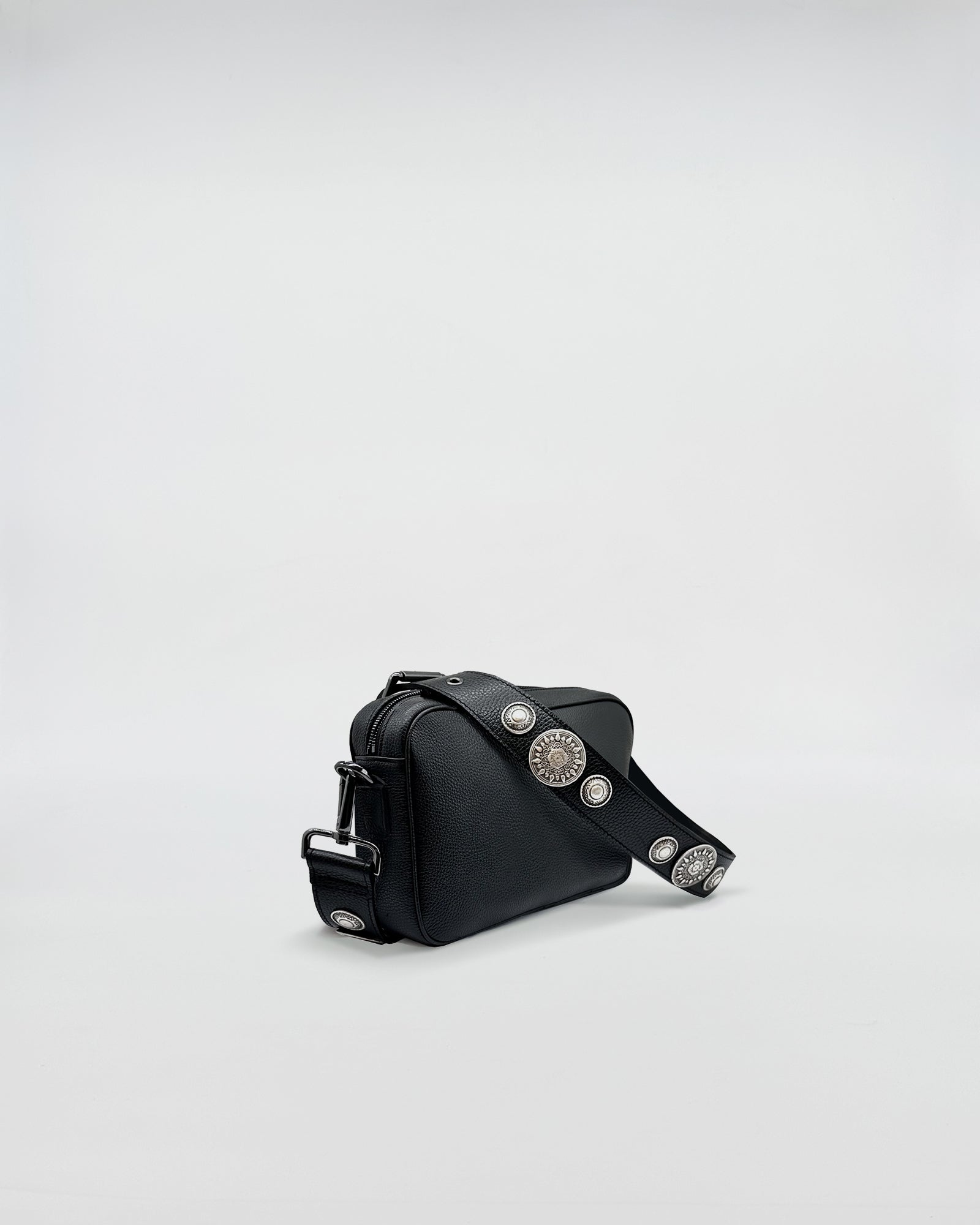 Side view of MAFALDA ROCK bag featuring a stylish design and adjustable rock-style strap with studs.