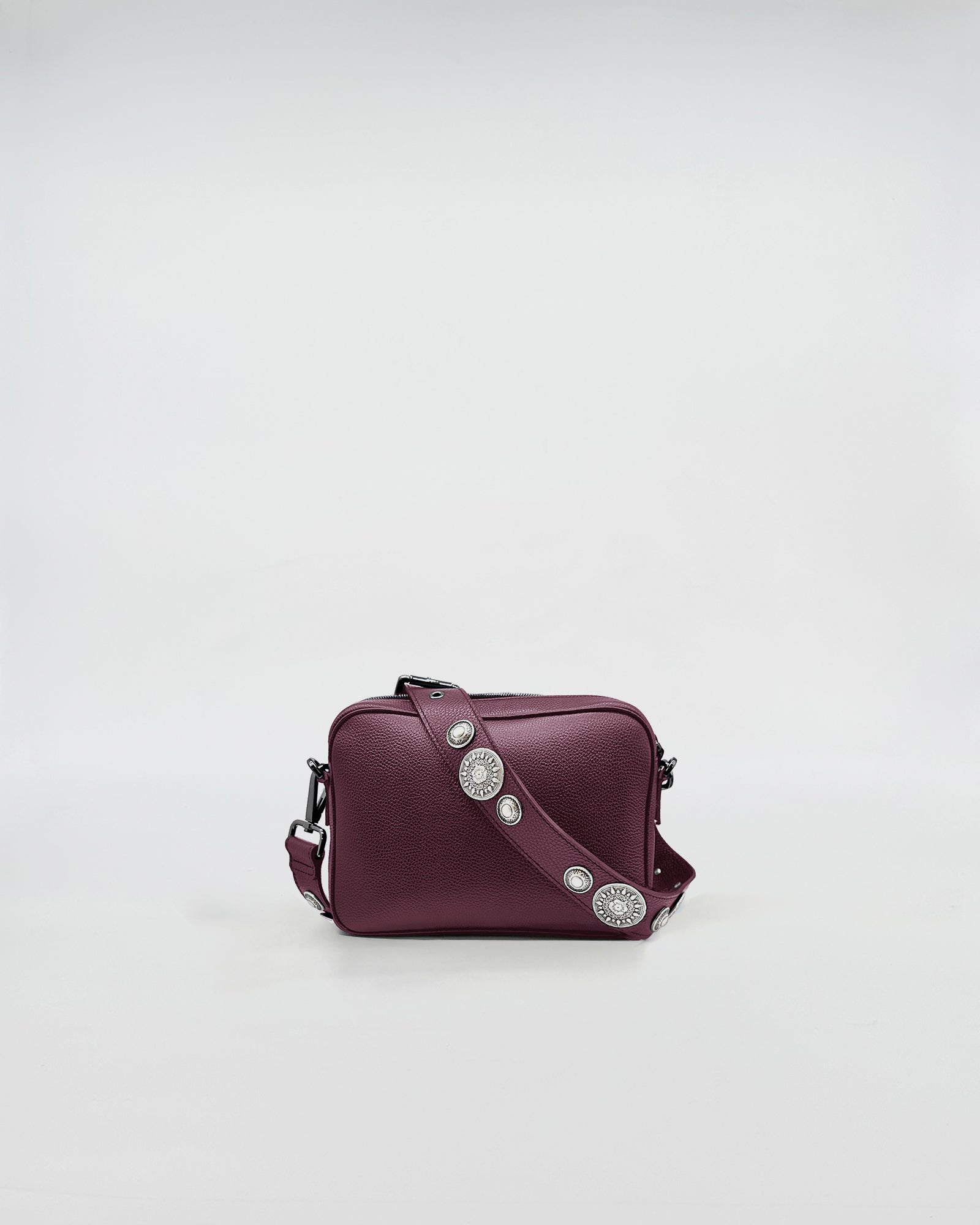 MAFALDA ROCK stylish burgundy crossbody bag with studded strap and organized interior.