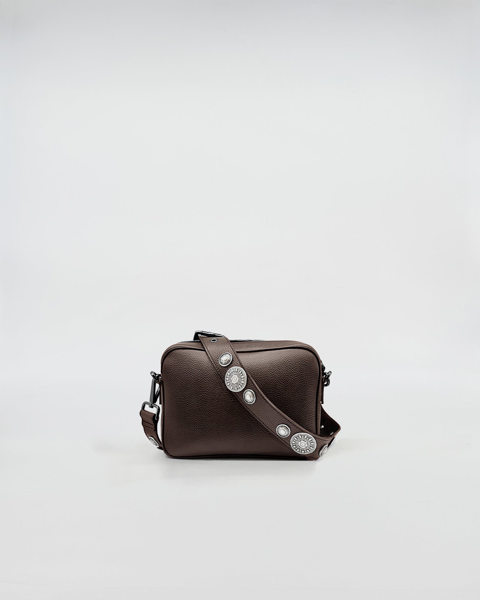 MAFALDA ROCK brown leather bag with decorative studs and adjustable strap.