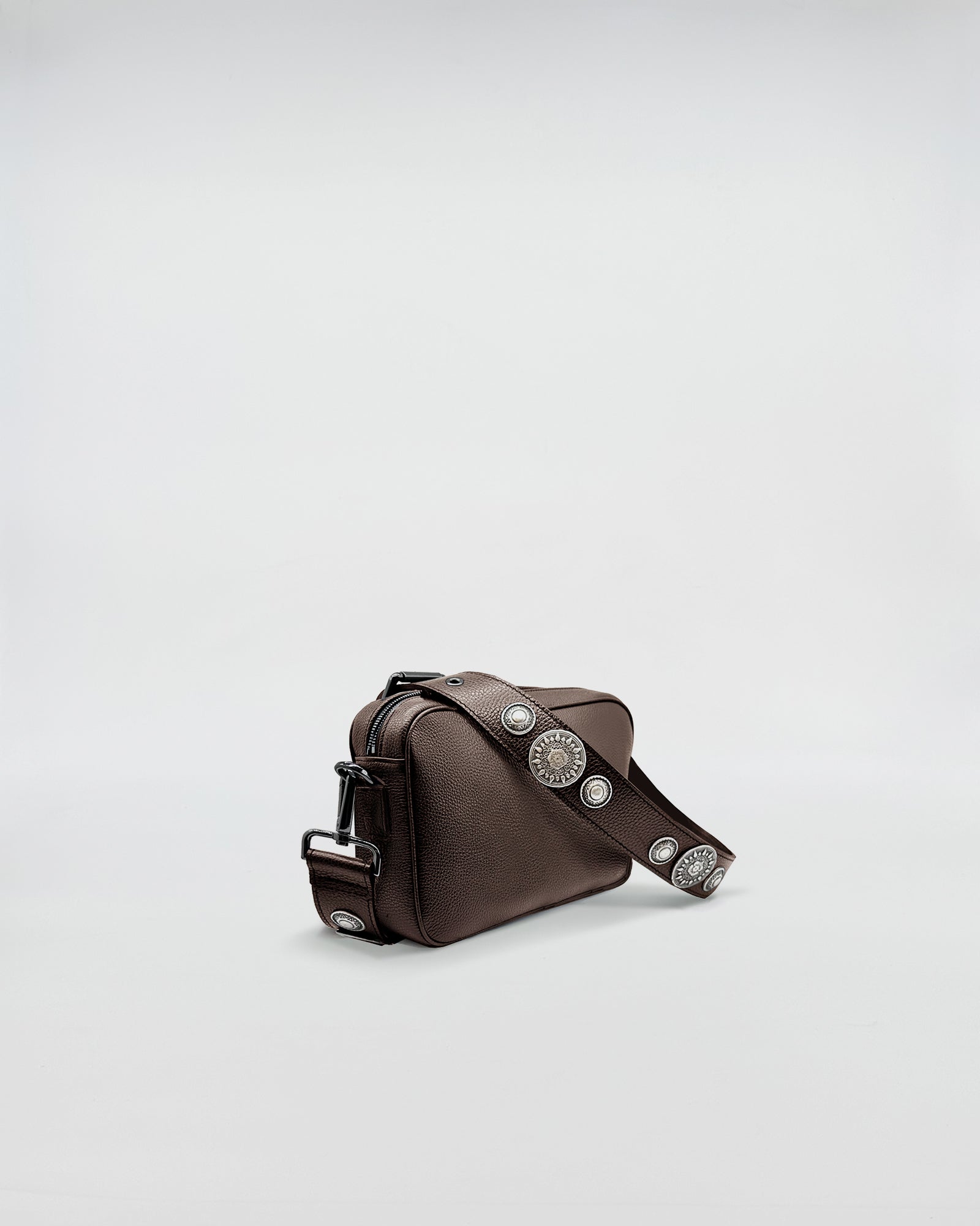 Mafalda Rock stylish brown bag with silver studs and adjustable strap for versatile looks.