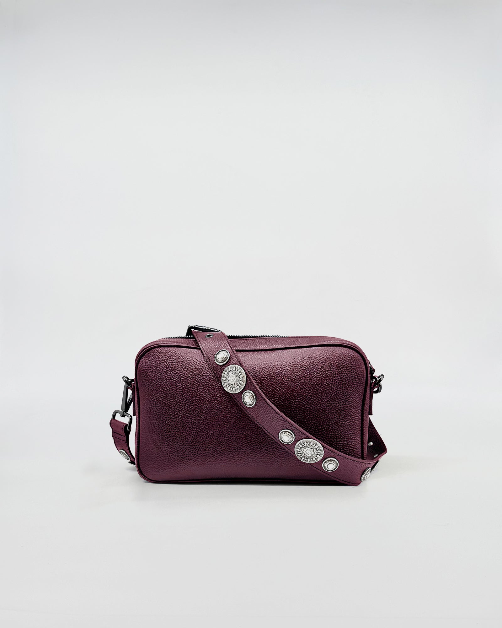 MAFALDONA ROCK burgundy handbag with decorative strap and adjustable crossbody design.