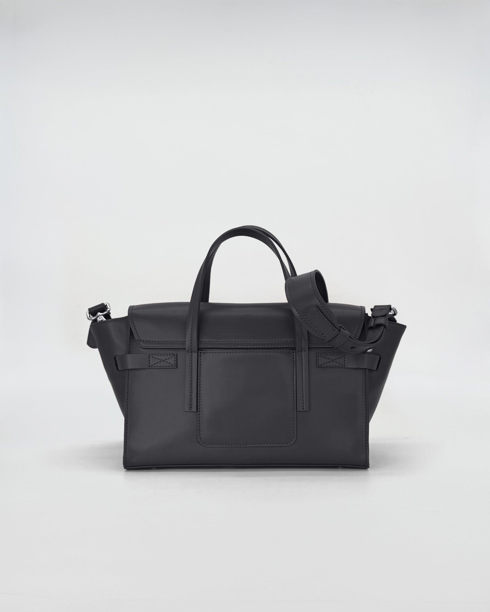 Penny Small Vitello handbag in black, featuring a sleek design with top handles and a detachable strap.