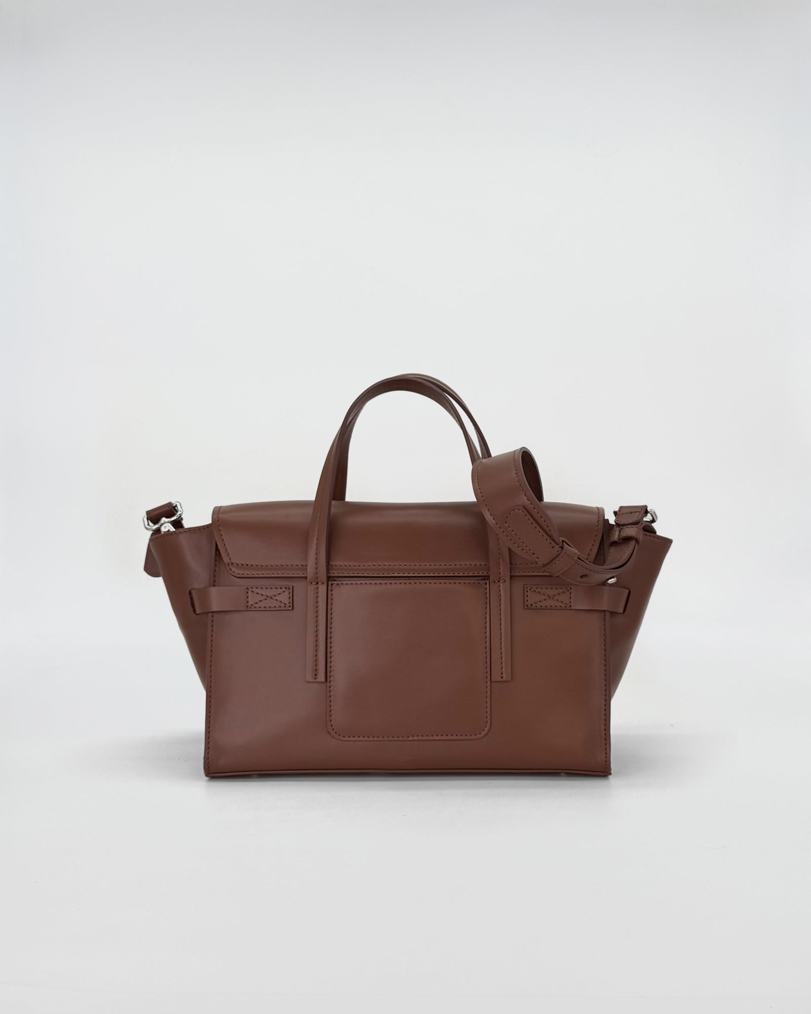 Elegant brown small vitello handbag with a sleek design and versatile shoulder strap.