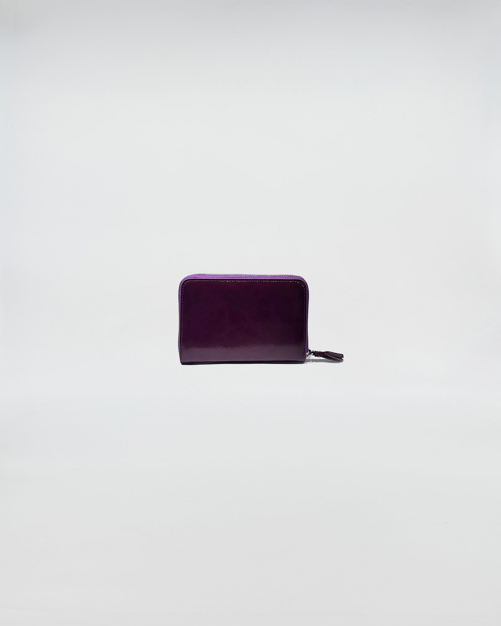 PORTAFOGLIO ZIP SMALL in elegant purple leather with zip closure, perfect for daily use and special occasions.