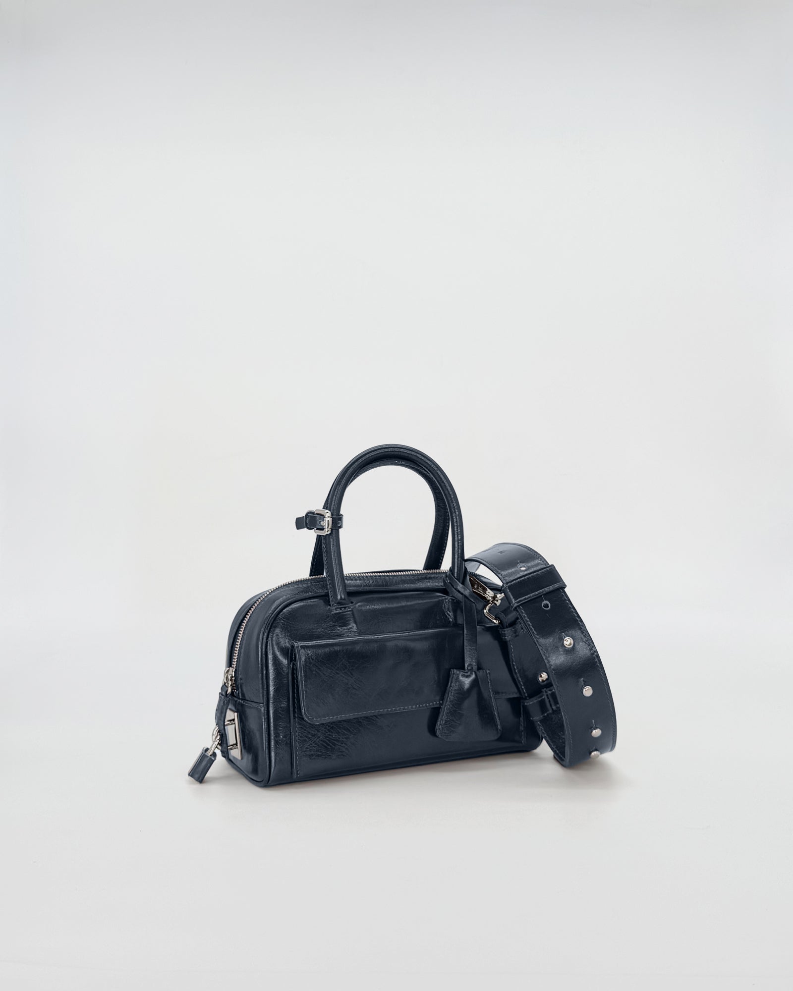 Zoe Mini Vitello Semilucido black handbag with detachable strap, stylish and compact design for elegance and practicality.