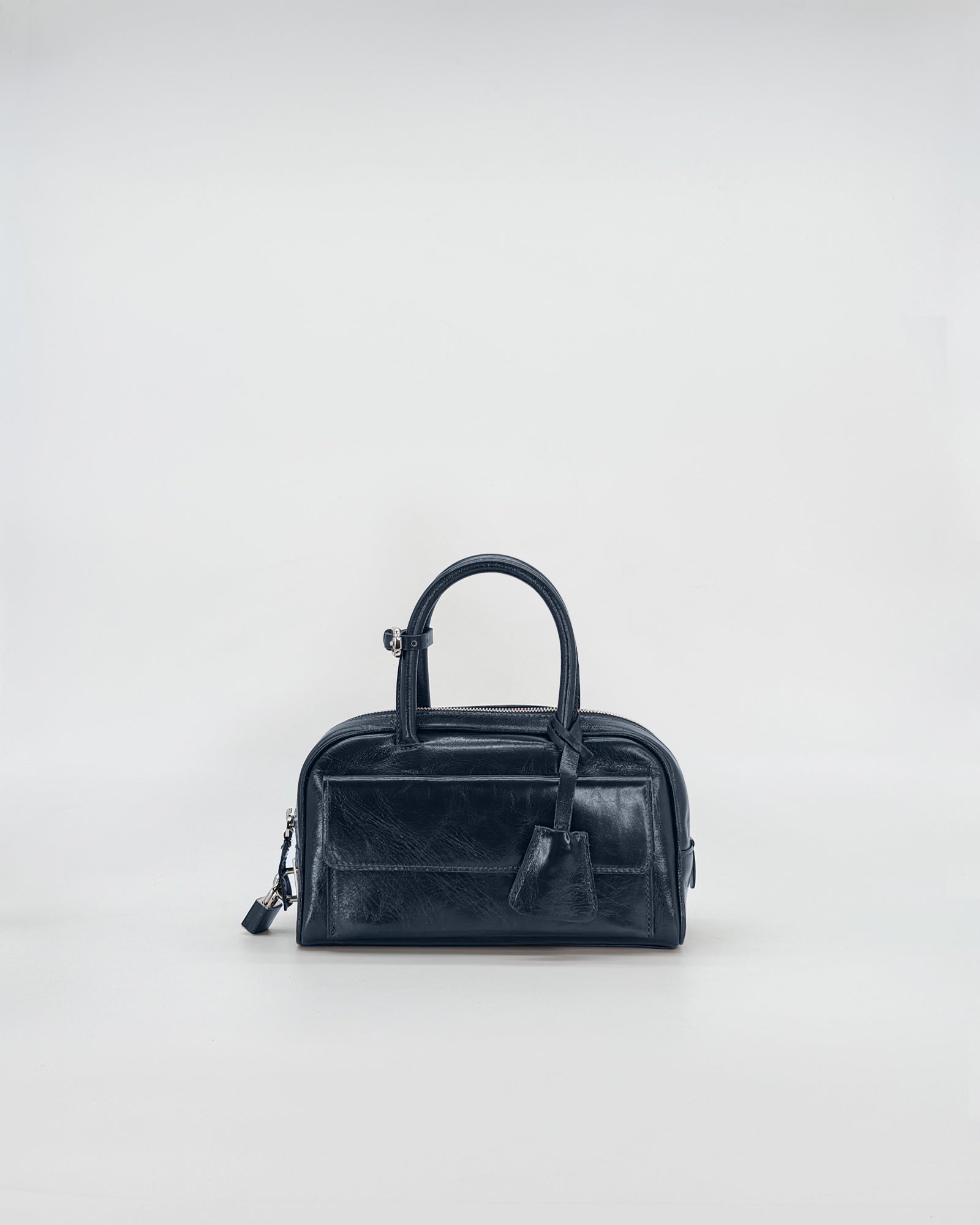 Zoe Mini Vitello Semilucido black leather handbag with elegant design and adjustable shoulder strap.