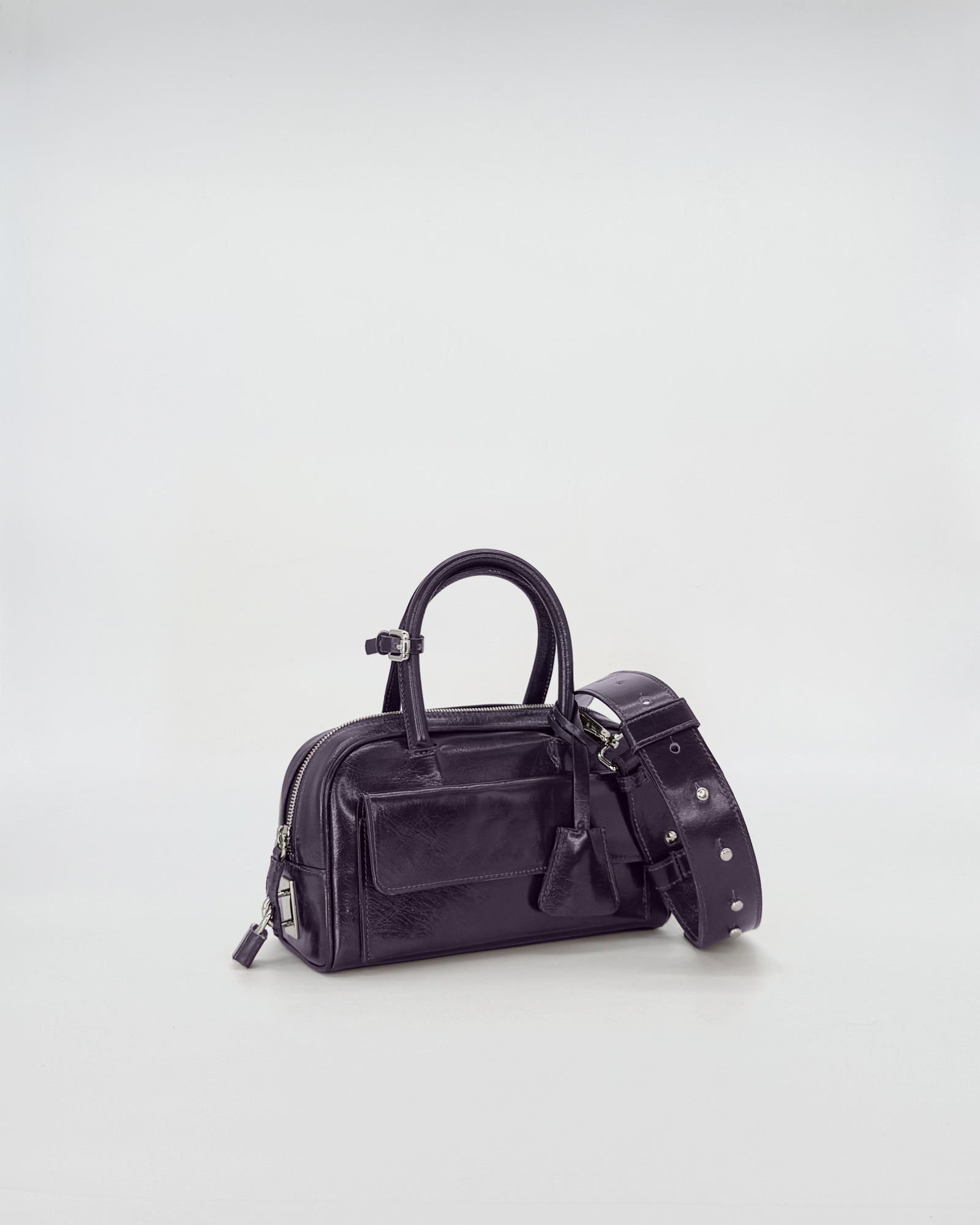 Compact and elegant Zoe Mini Vitello Semilucido bag in black, featuring a stylish shoulder strap.