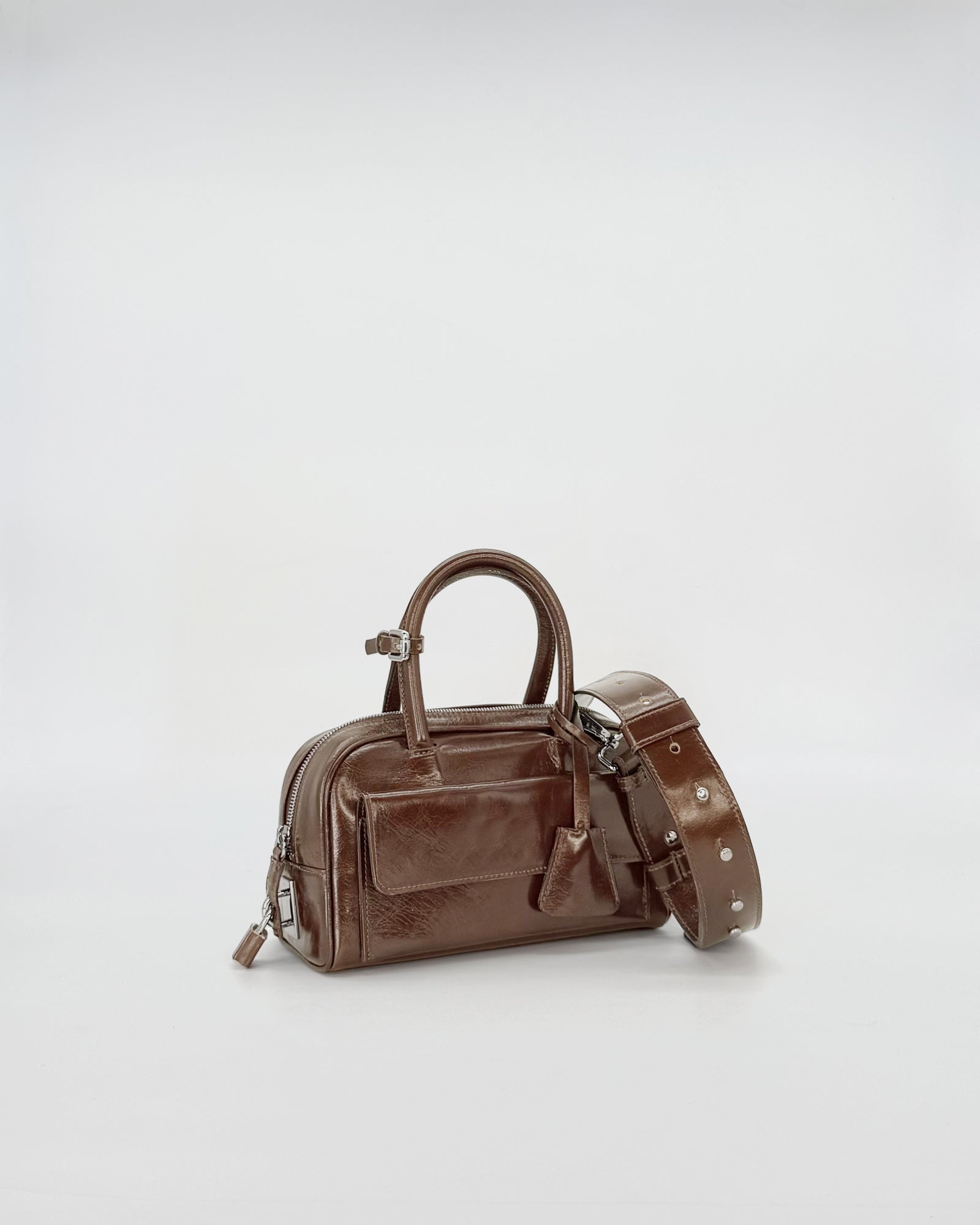 Zoe Mini Vitello Semilucido handbag in brown with shoulder strap, stylish and compact design for casual outings.