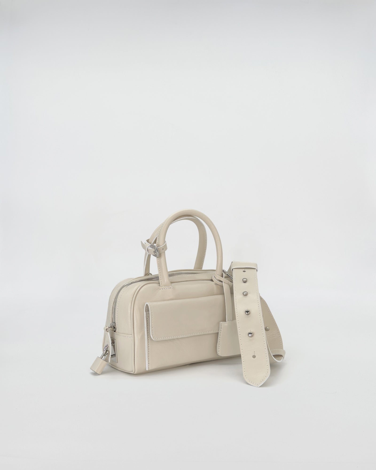 Zoe Mini Vitello Semilucido handbag in light beige, showcasing a compact design with elegant styling.