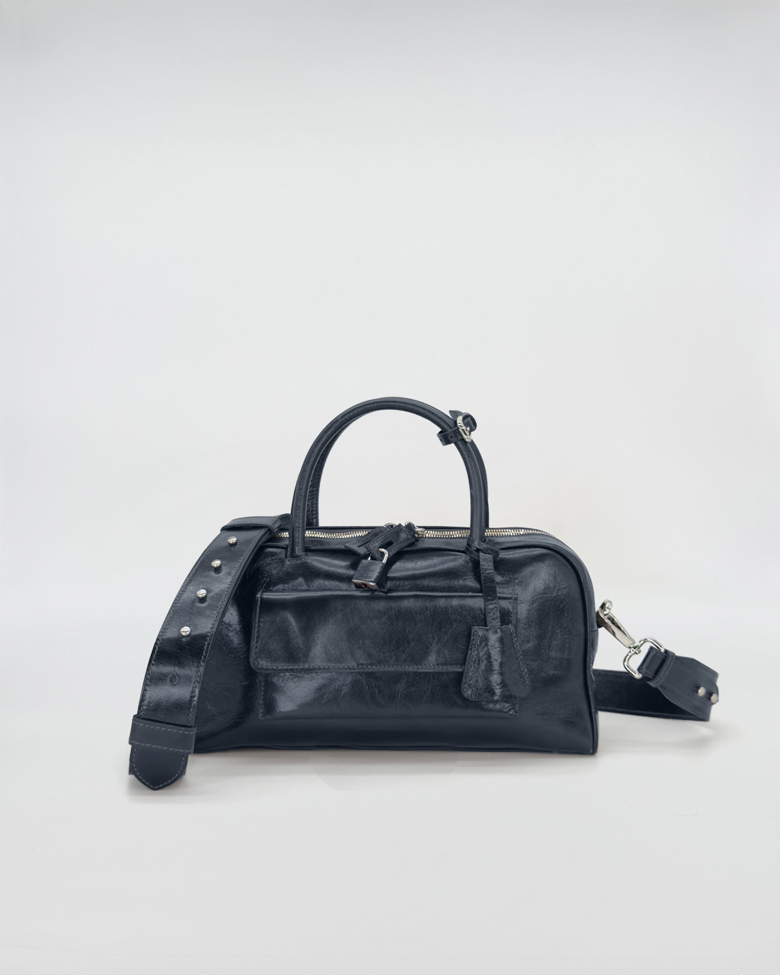 Zoe Small Vitello Semilucido handbag with a sleek design and detachable shoulder strap on a neutral background.