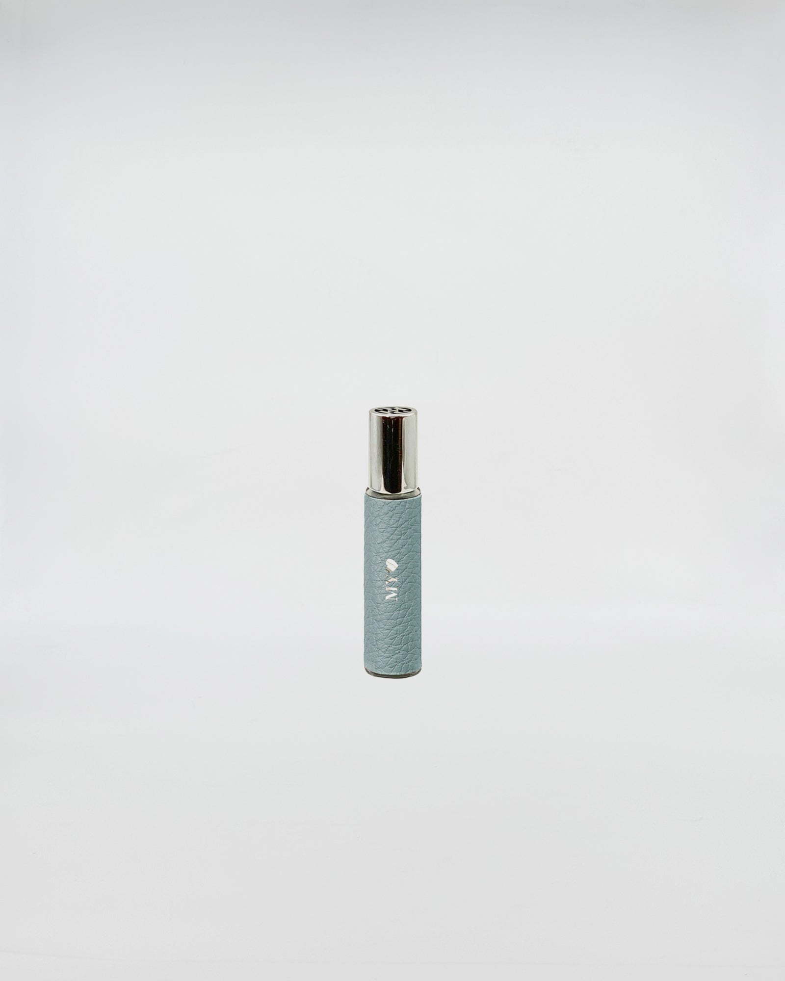 1221 FRAGRANCE EAU DE PARFUM AVIO in a travel-sized blue spray bottle on a neutral background.