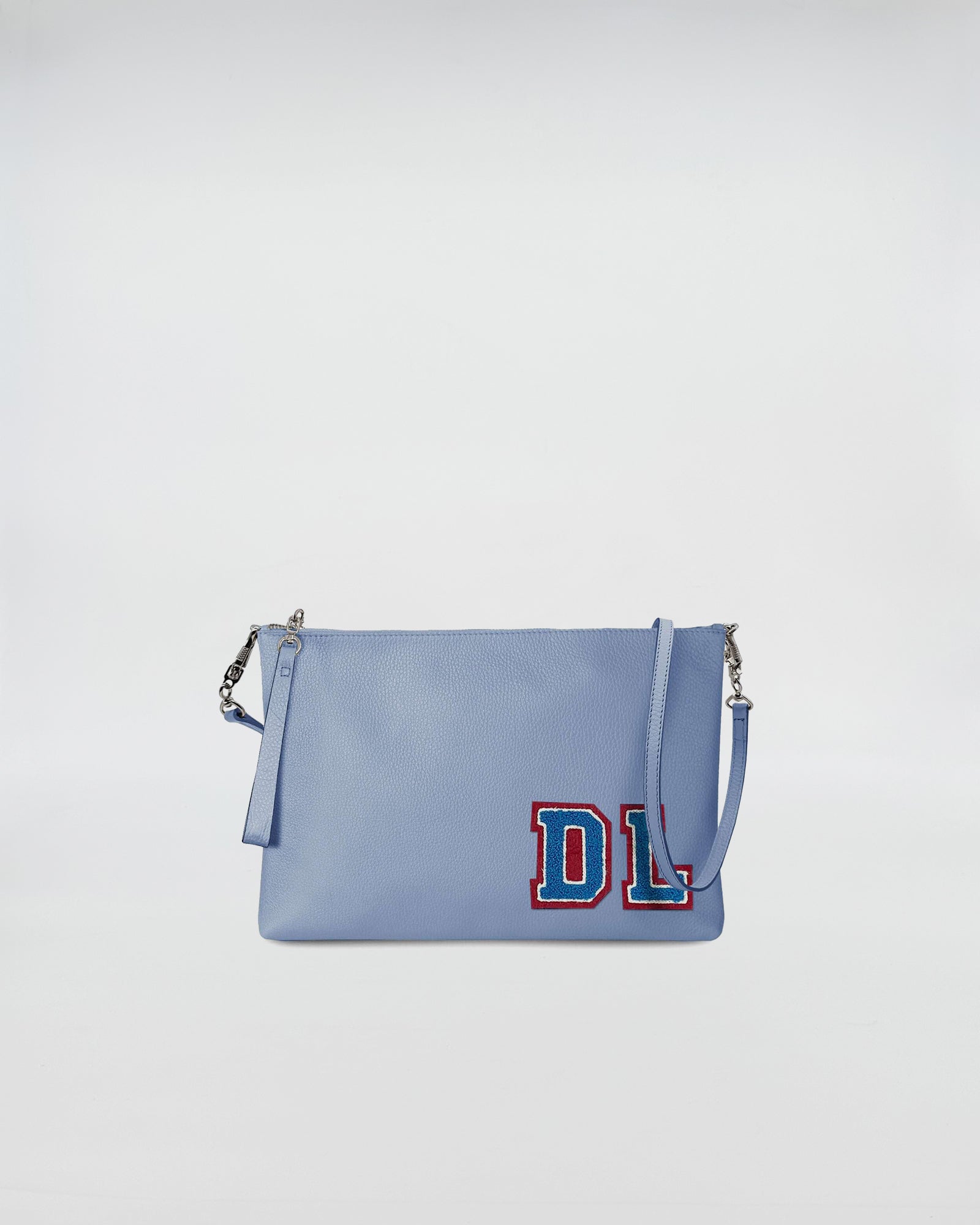 BUSTA A4 PERSONALIZZATA CON TRL, borsa azzurra con patch, tracolla rimovibile, design compatto.