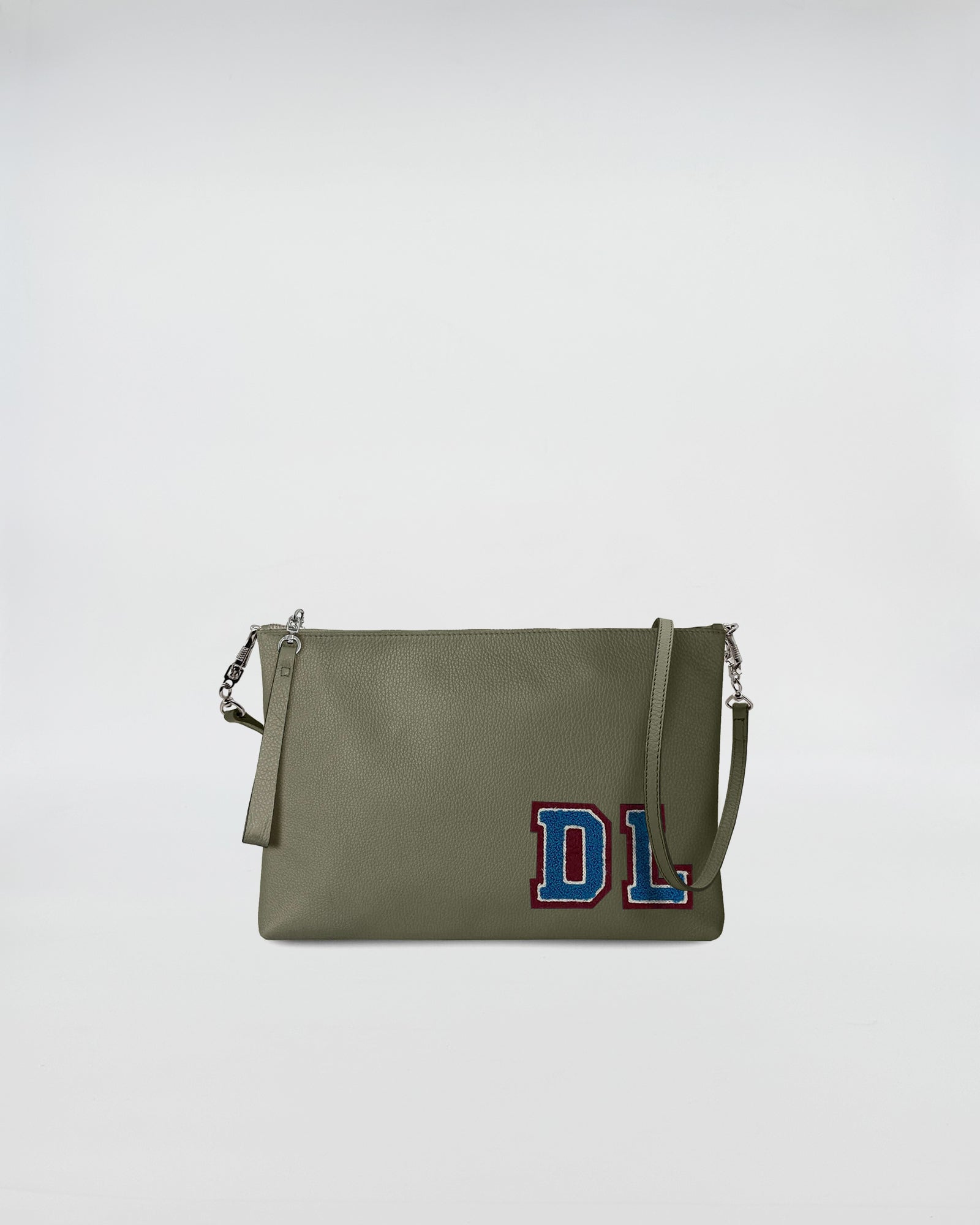 BUSTA A4 PERSONALIZZATA CON TRL in green with removable strap and custom patch design.