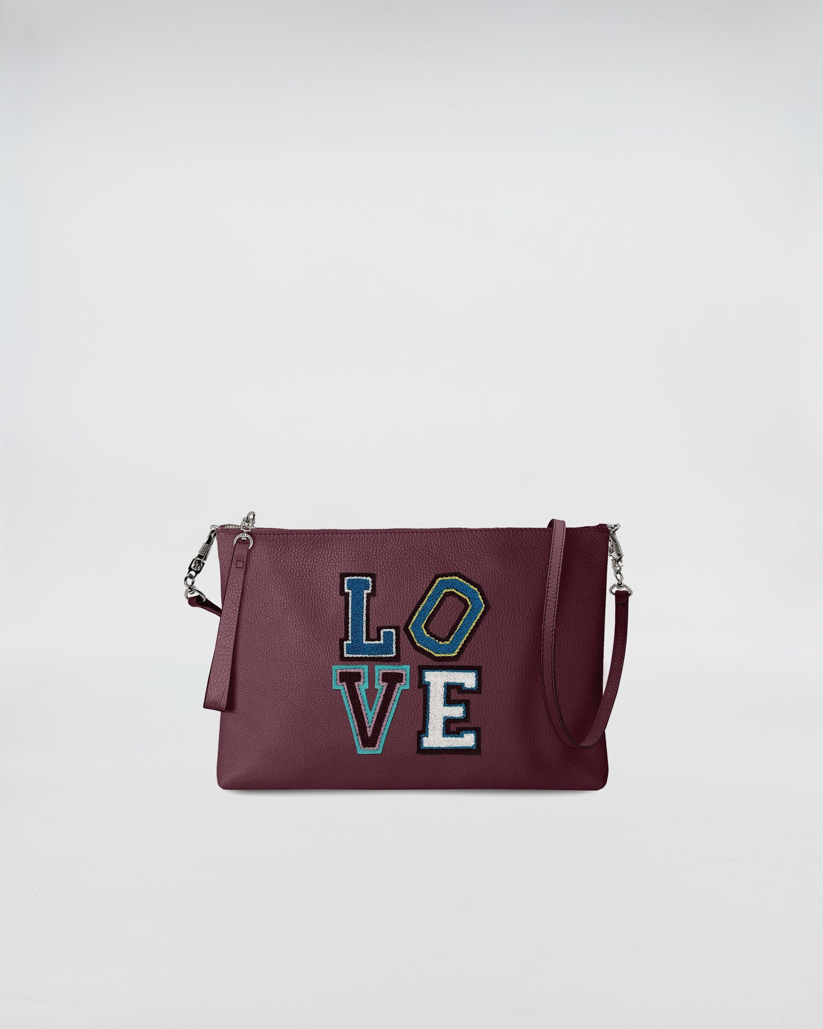 BUSTA A4 CON TRL LOVE in deep burgundy with colorful LOVE patch and removable shoulder strap.