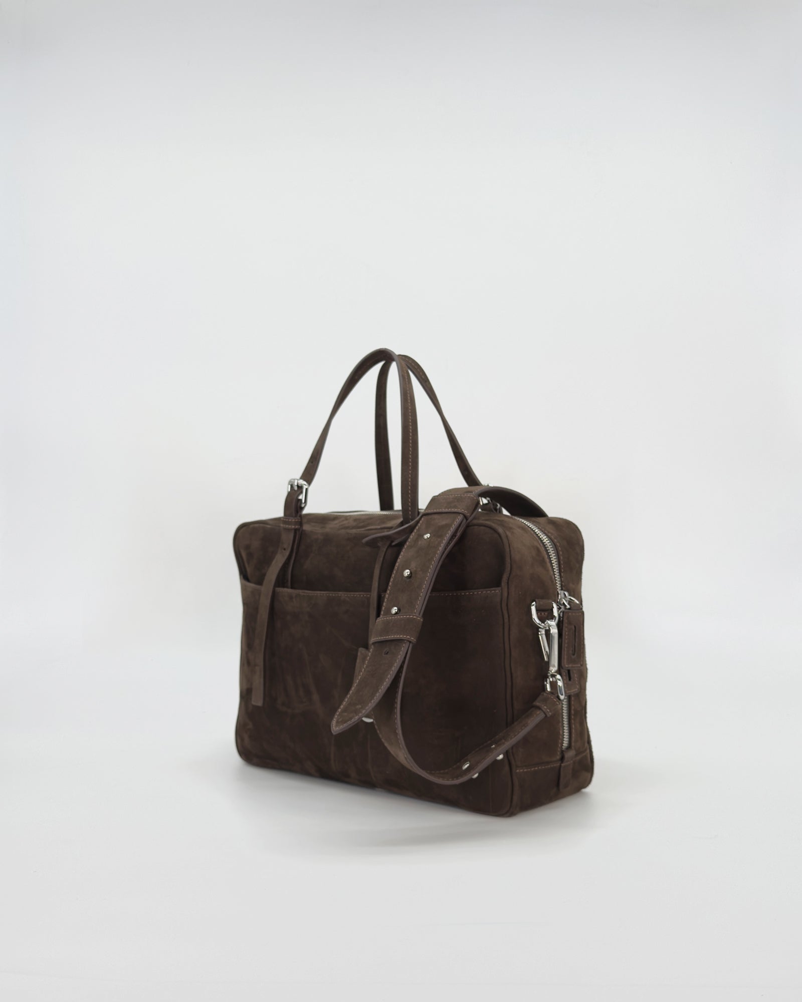 Frida medium nabuk bag in soft brown suede with dual handles and adjustable strap.