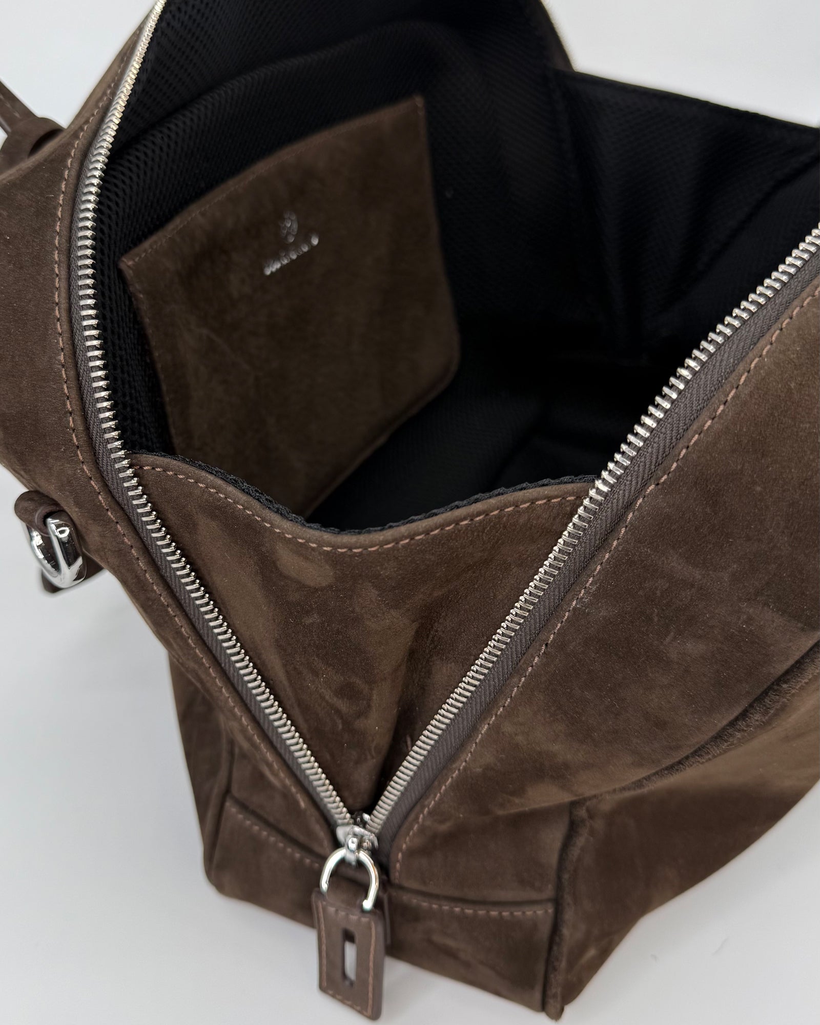 Interior view of the FRIDA Medium Nabuk bag showcasing its spacious compartment and elegant design.