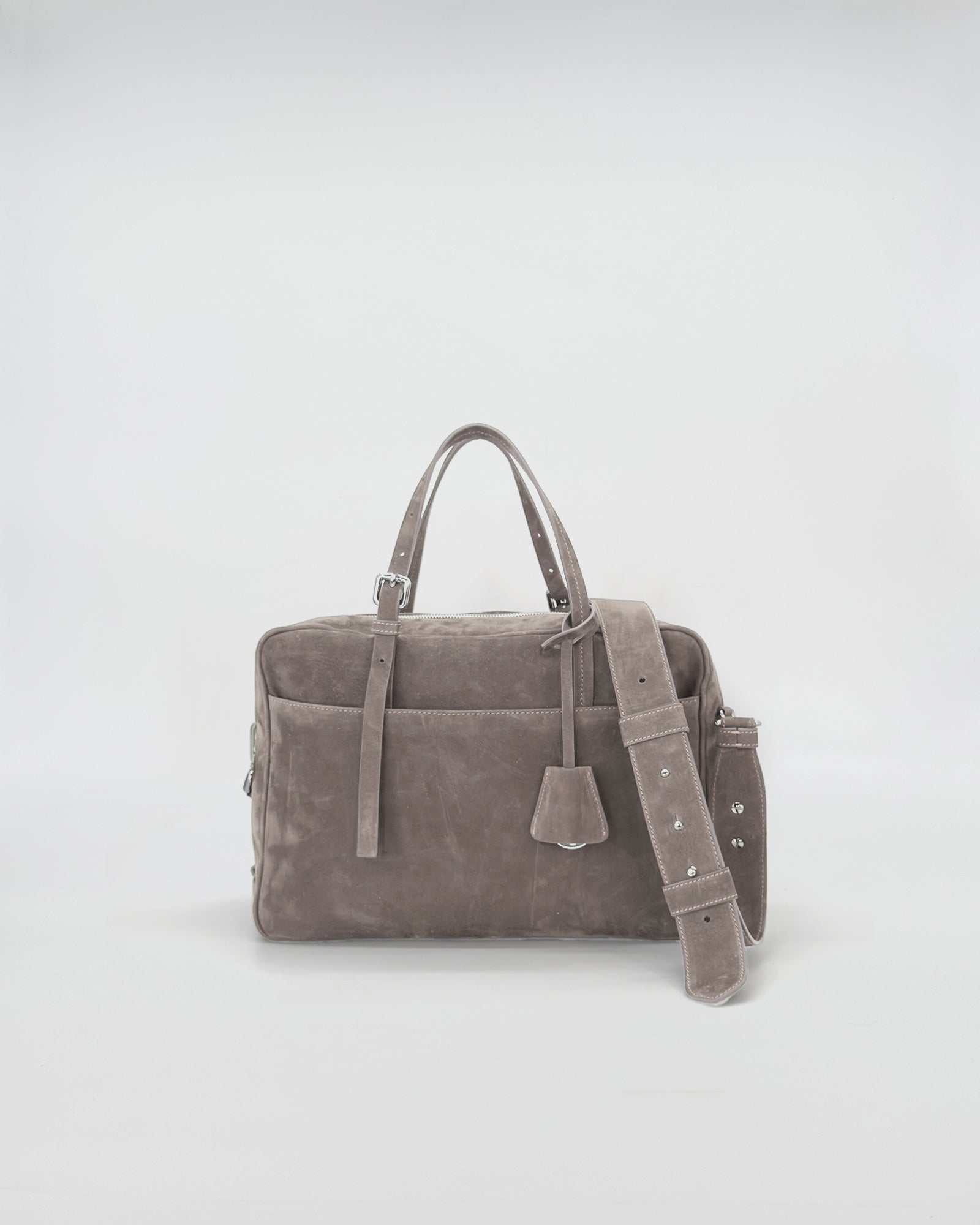 Frida medium nabuk bag in gray with a sleek design, featuring a shoulder strap and a sophisticated retro look.