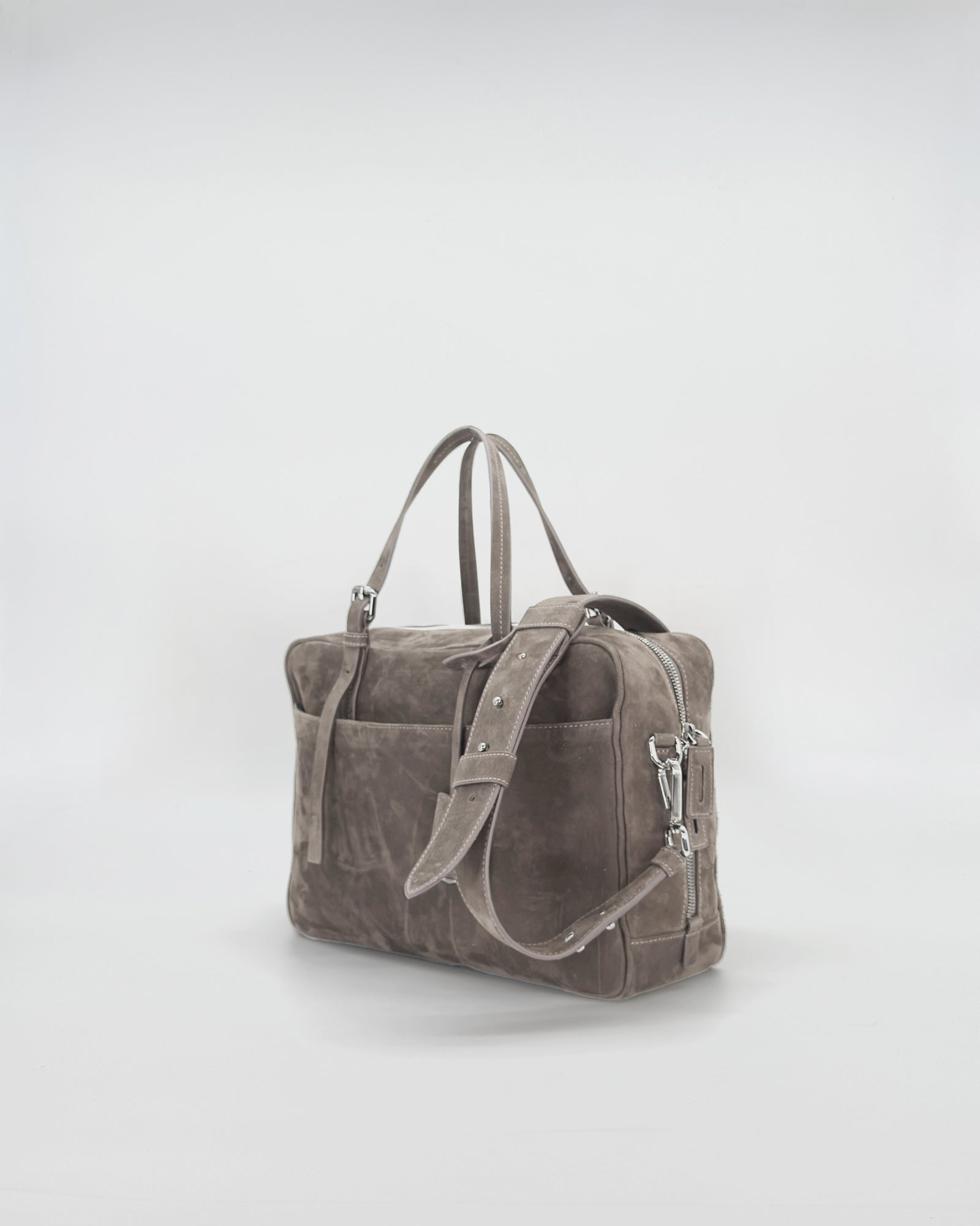 Frida medium nabuk bag with a vintage design, showcasing soft suede texture and dual carrying handles.