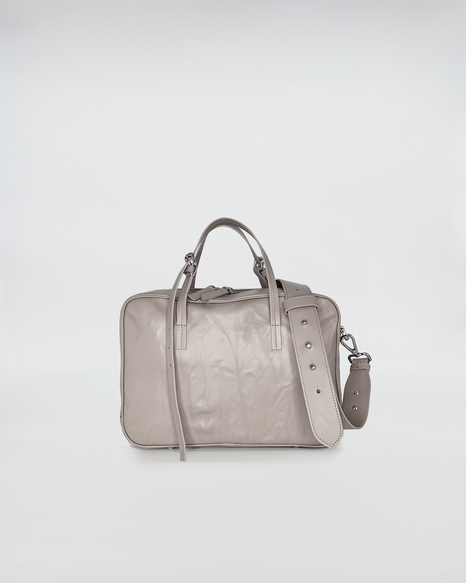 FRIDA MEDIUM VITELLO LAVATO elegant gray handbag with adjustable strap and retro design.