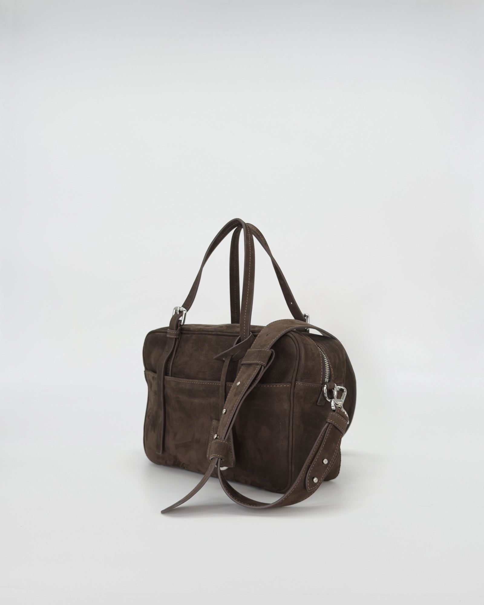Frida Small Nabuk brown suede bag with dual handles and adjustable strap, showcasing a sleek and modern design.