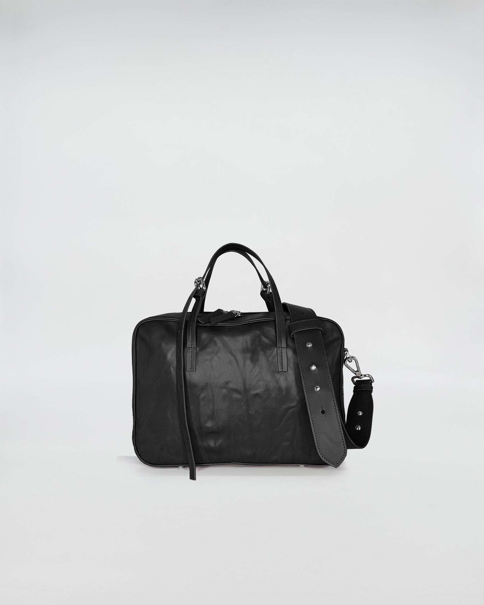 FRIDA SMALL VITELLO LAVATO black leather handbag with adjustable strap, showcasing modern vintage elegance.