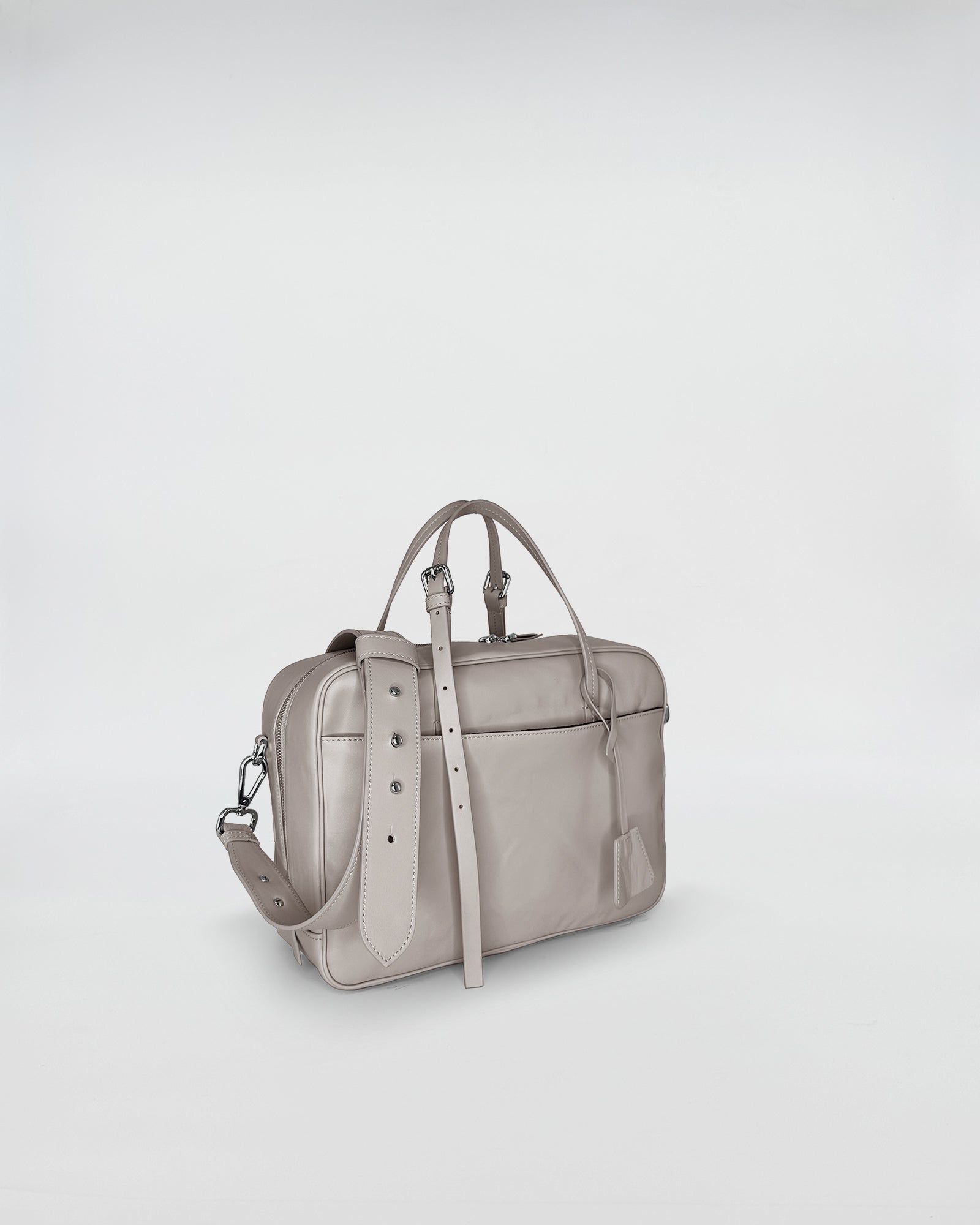 FRIDA SMALL VITELLO LAVATO versatile handbag in soft grey leather with adjustable strap and retro-modern design.