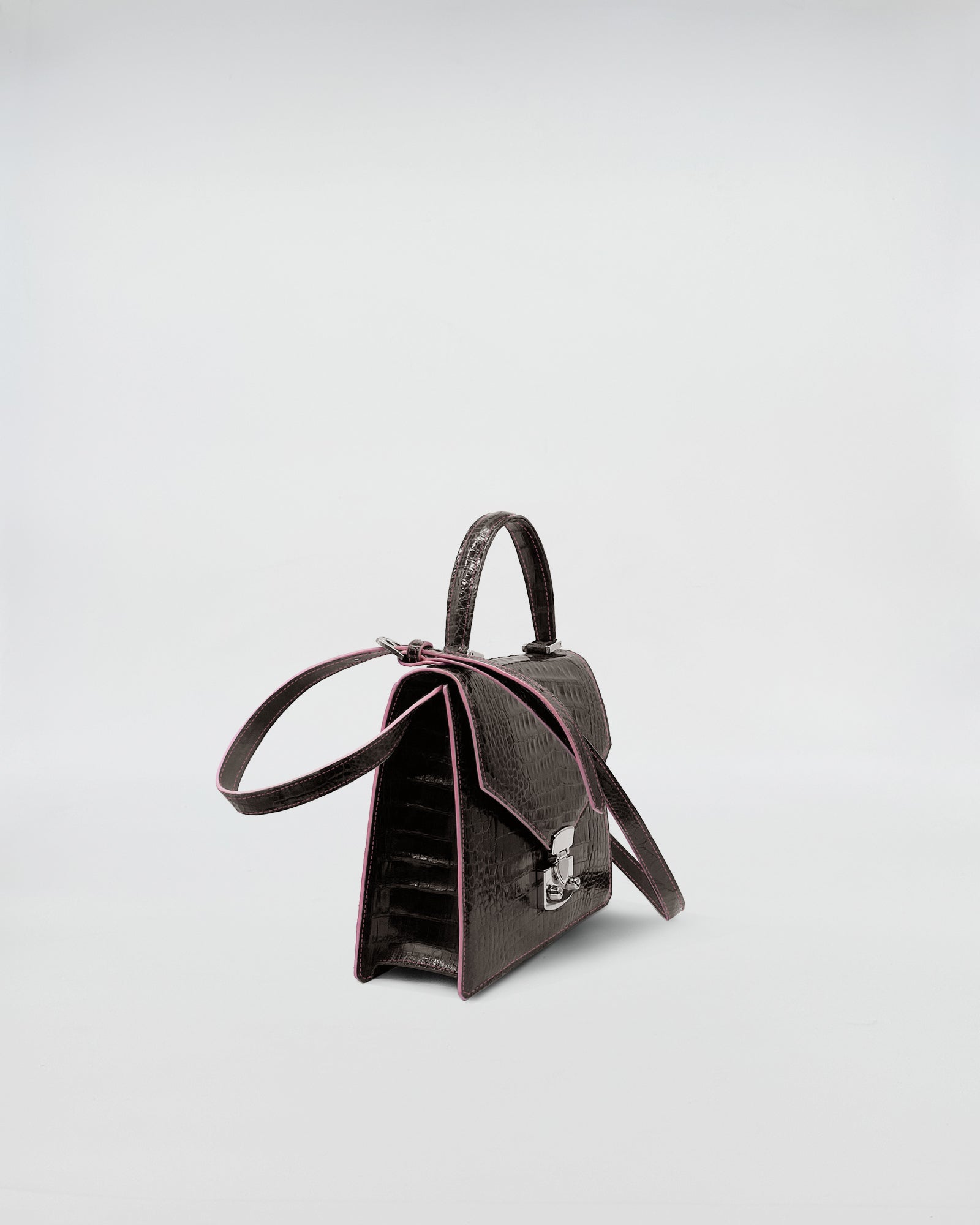 Lady D - Cocco Recycle handbag featuring recycled crocodile leather and suede interior.
