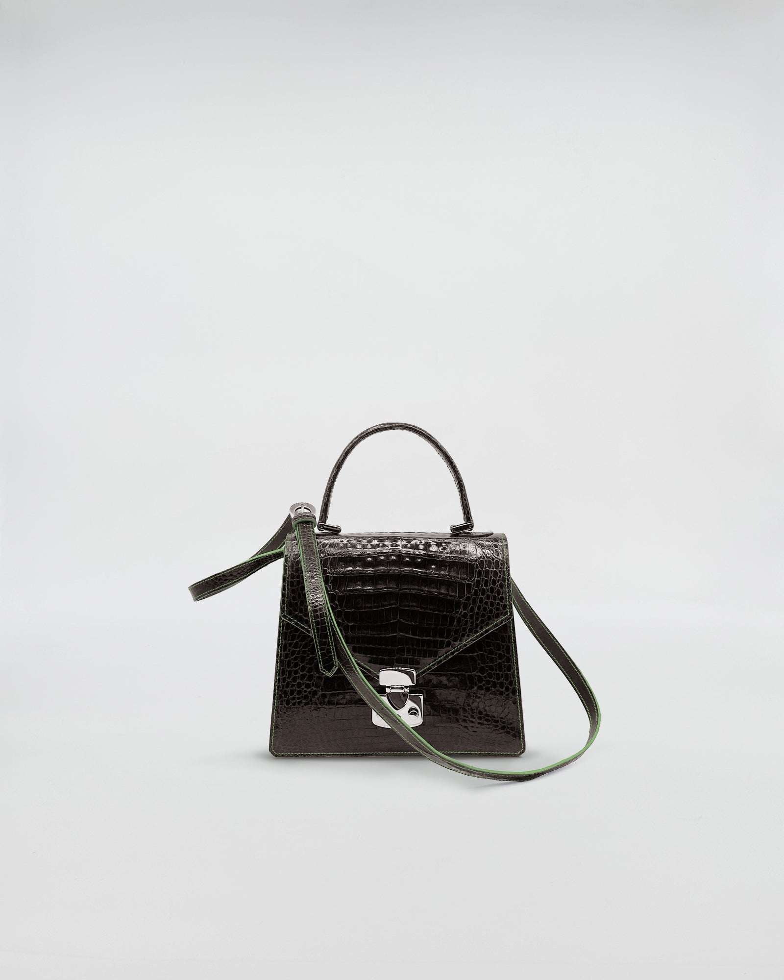 LADY D - COCCO RECYCLE handbag in black recycled crocodile leather with a green suede interior and adjustable strap.