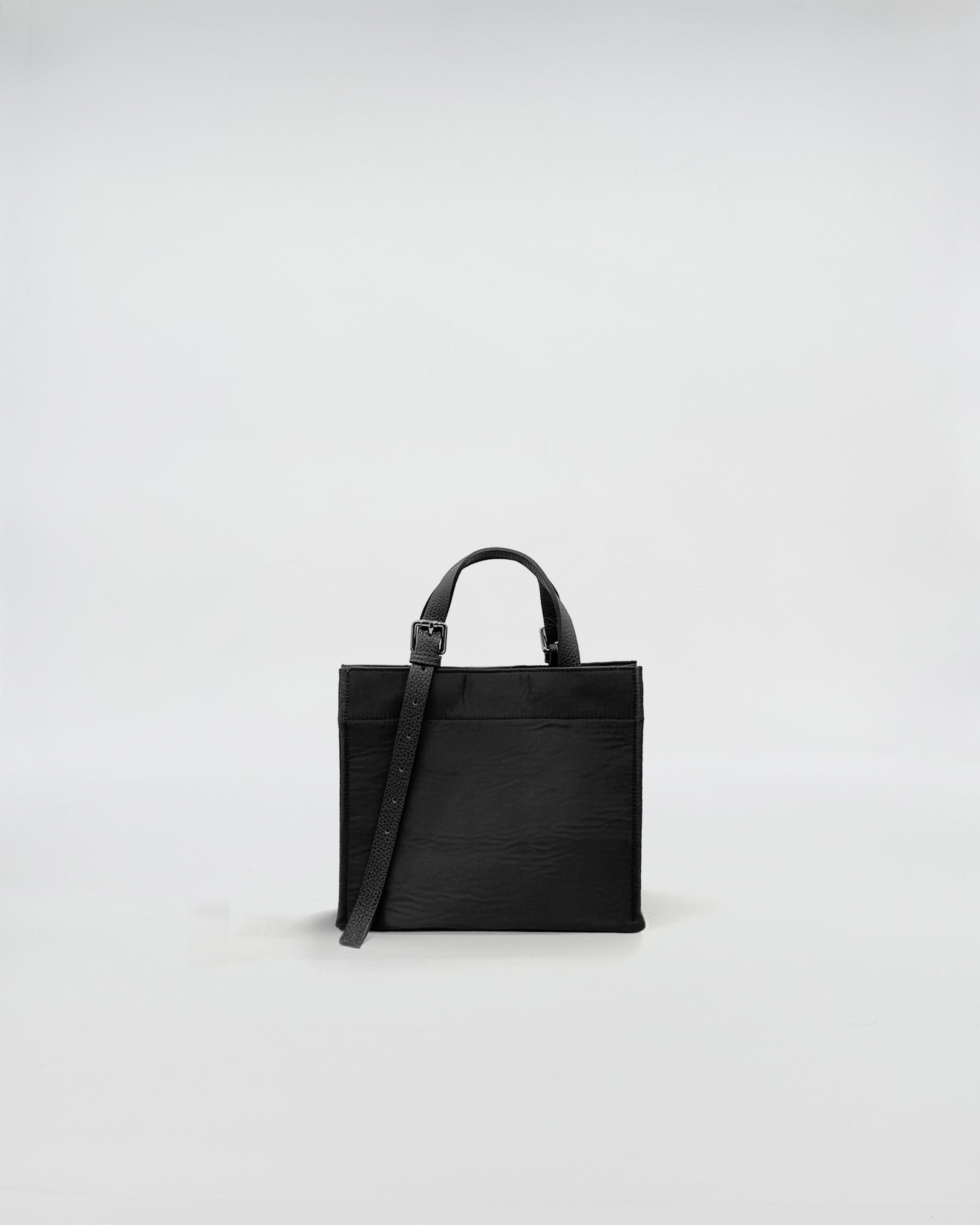 LUDOVICA MINI  TESSUTO TECNICO black bag with handle and shoulder strap on a plain background.