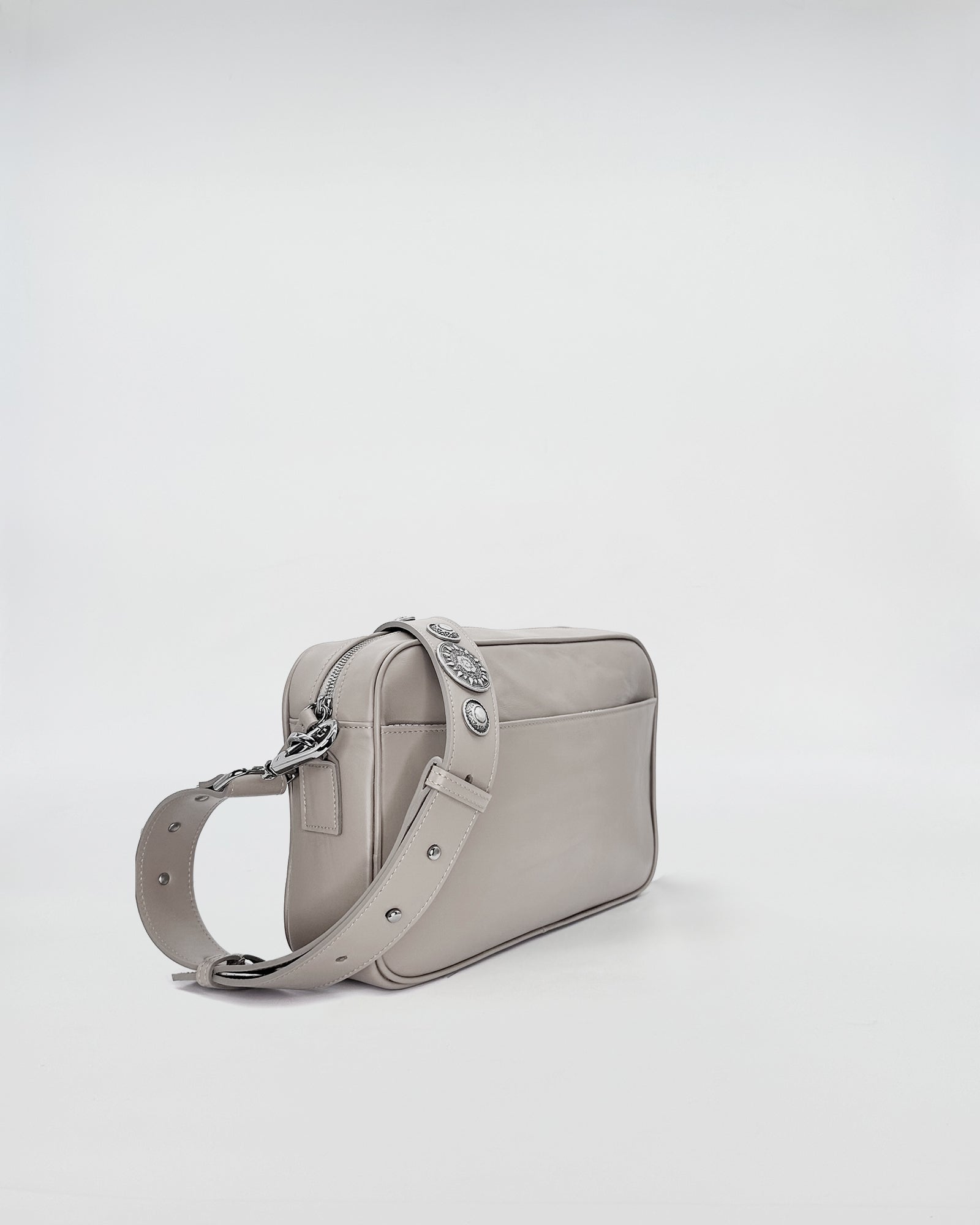 Back view of MAFALDONA VITELLO LAVATO ROCK handbag featuring a removable strap and chic design.
