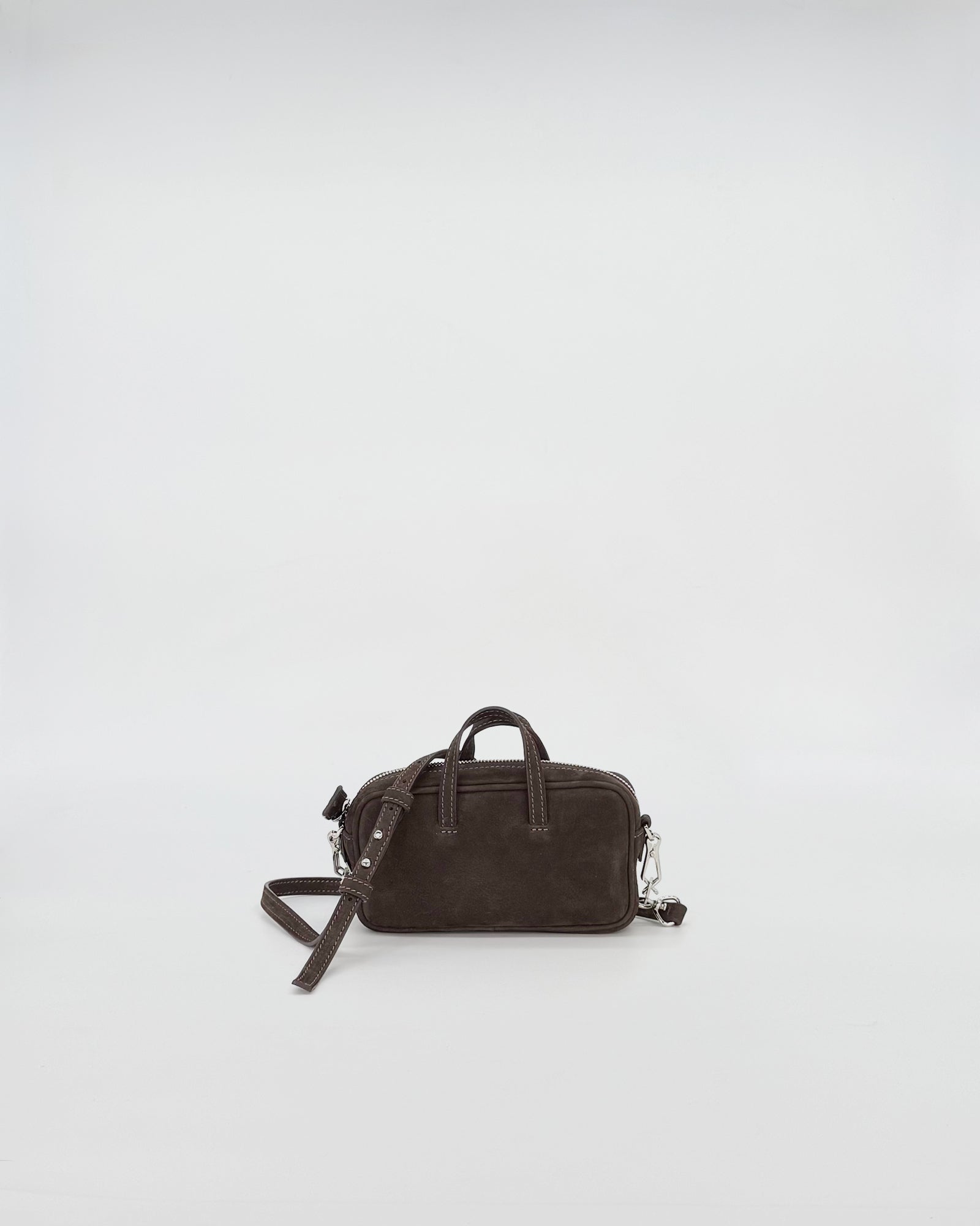 Nina Medium micro bag in soft nabuk leather with chain handle, elegant and compact design.