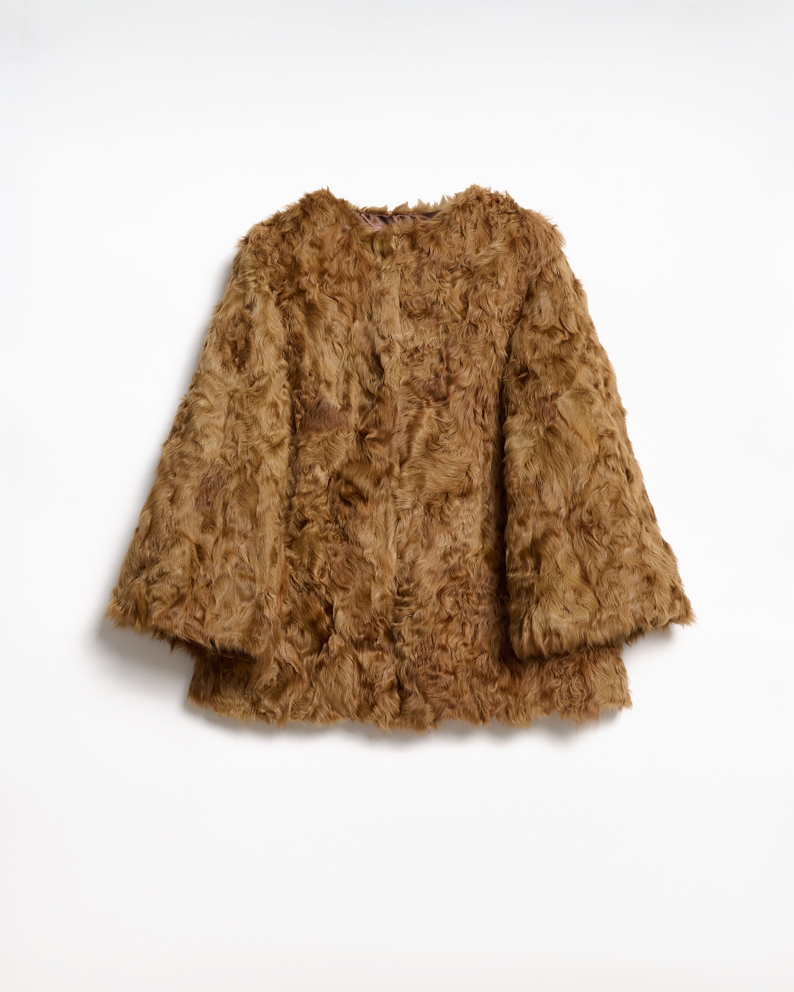 Caban in Agnello UPCYCLE, audace giacca in pelliccia marrone con silhouette contemporanea e gilet in lana staccabile.