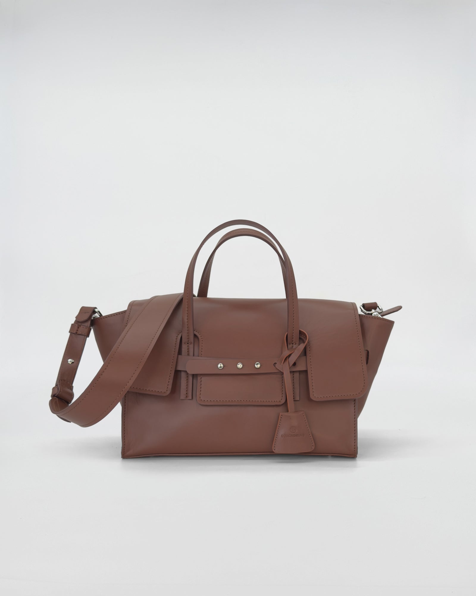 Penny Small Vitello handbag in soft brown leather with a sleek design and adjustable strap.