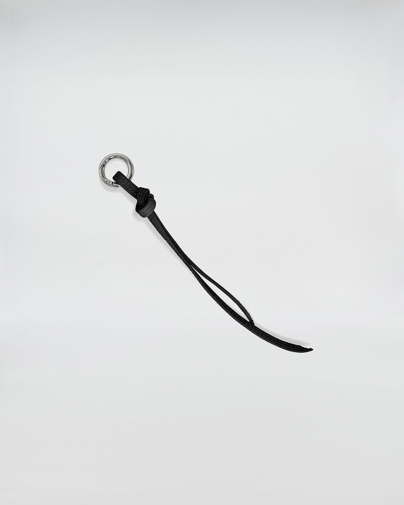 CHARMS IN PELLE FIOCCO with metal ring and black leather strap for unique accessory styling.