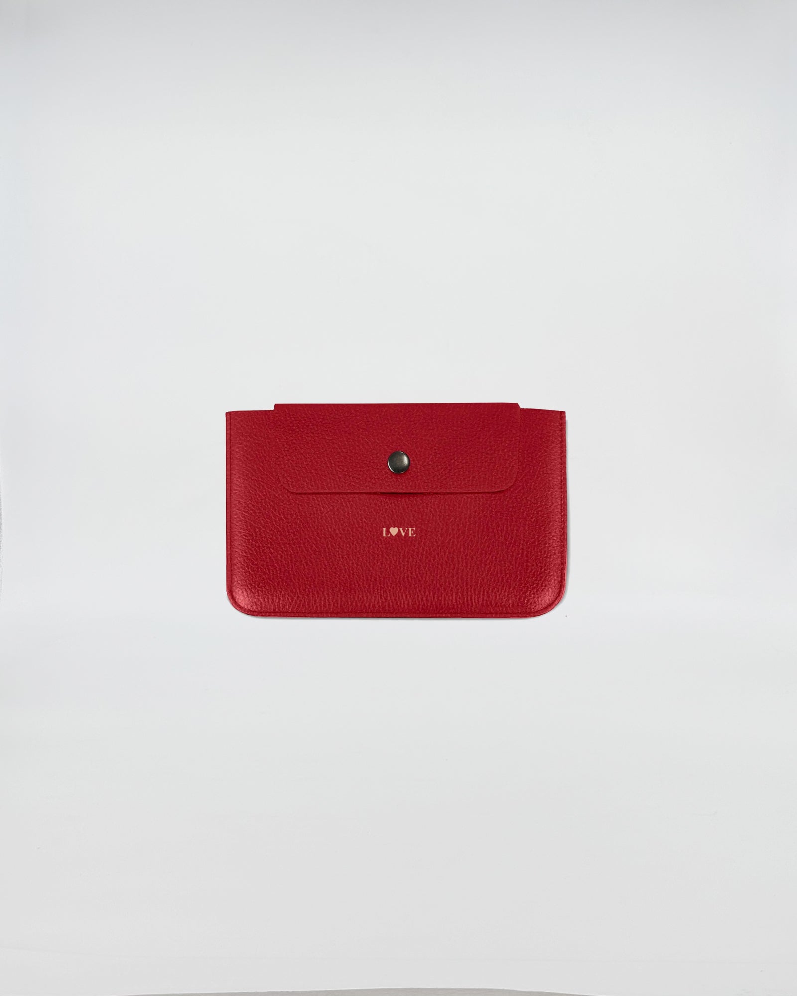 PORTA DOCUMENTI LOVE in red leather featuring a stylish snap closure and embossed 'LOVE' label.